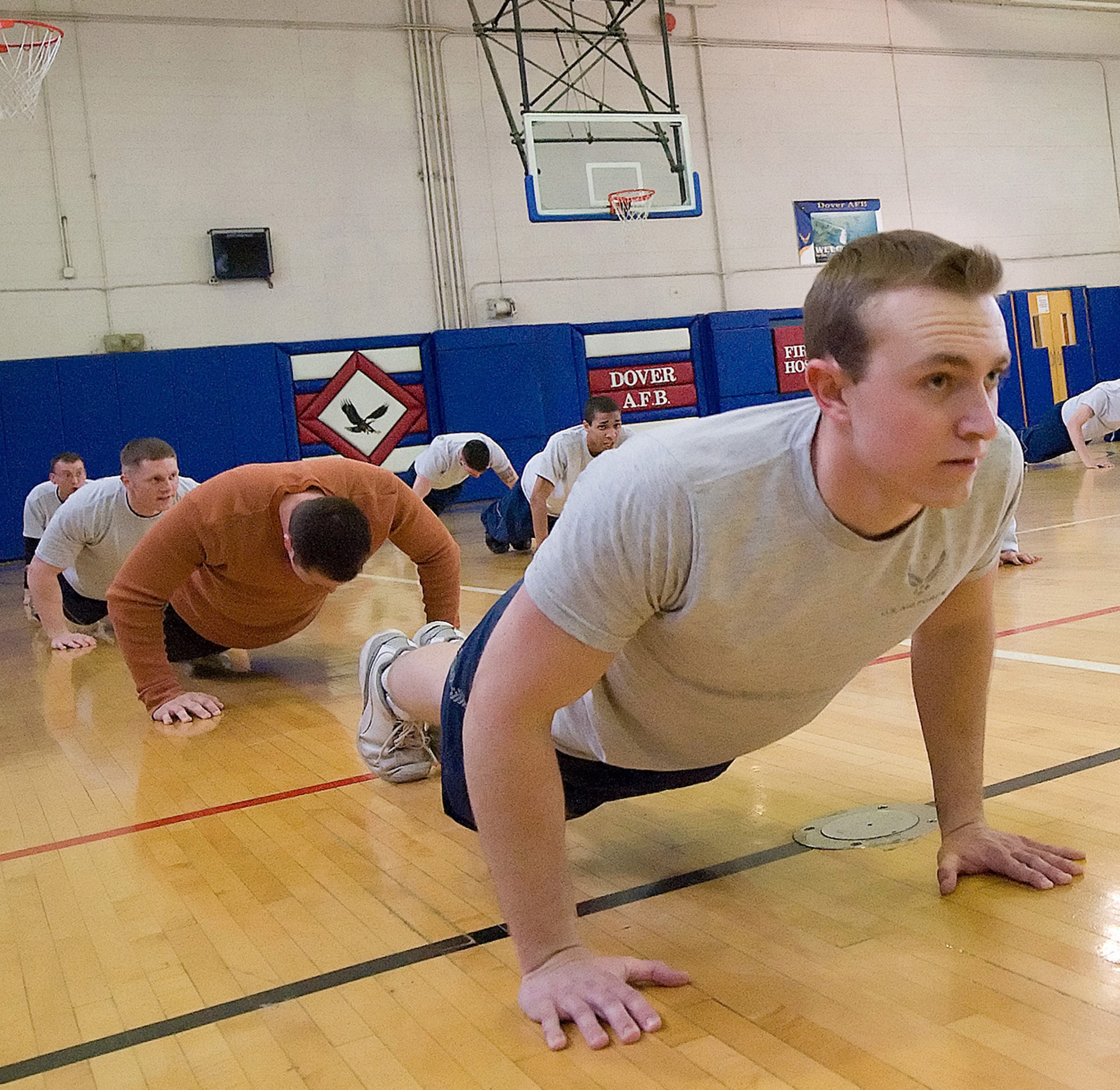 Senior Airman Simon Moffatt, 436th Civil Engineer Squadron, learns the proper way to do push-ups as he becomes a Physical Training Leader at the Fitness Center during a PTL class. (U.S. Air Force photo/ Jason Minto)