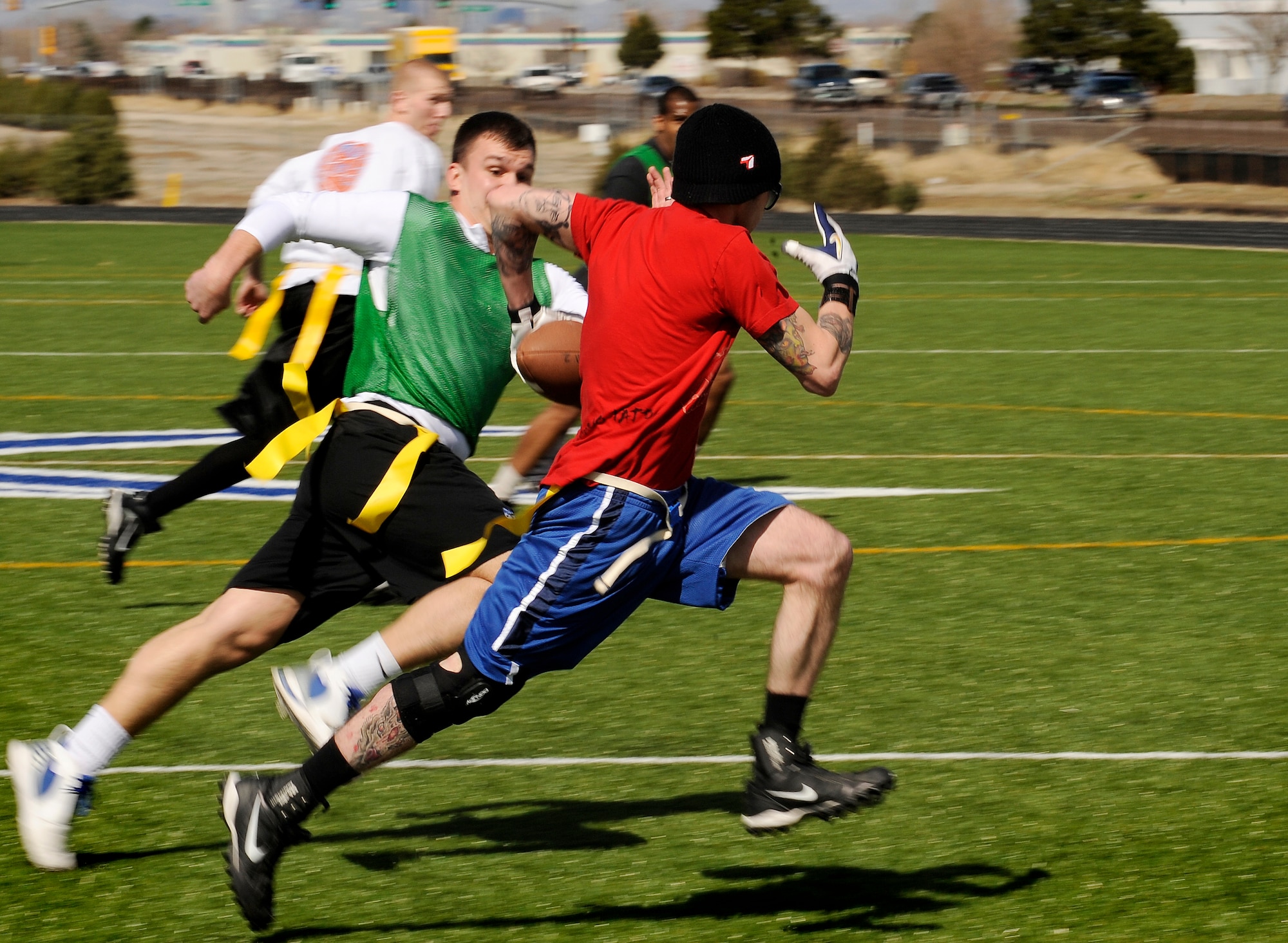 BUCKLEY AIR FORCE BASE, Colo. -- Participants from last’s years flag football league head for a touch down.  This year’s Team Buckley Flag Football sign up deadline is Sept 18.  The season starts Sept 28. For more information, contact the fitness center. (U.S. Air Force photo by Senior Airman Steven Czyz)