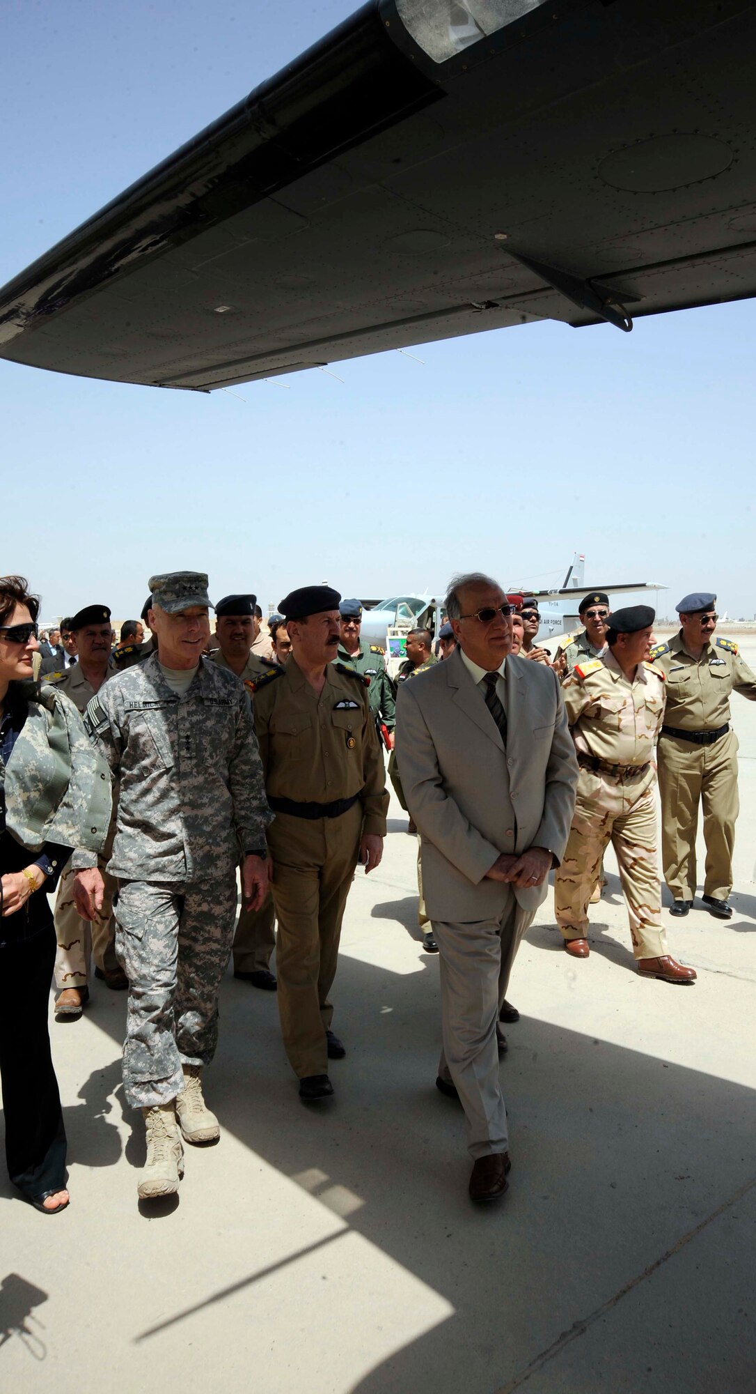 Lt. Gen. Frank Helmick, Mulit-National Security Transition Command-Iraq commanding general (left), Abd al-Qadir al-MUFRIJI, Iraqi Minister of Defense, look at one of the Iraqi aircrafts on display during the 78th annual Iraqi Air Day at New al-Muthana Air Base, Iraq April 22, 2009. U.S. Air Force Airman and Iraqi military members attended the event to celebrate how far the Iraqi air force has come [in]the past few years.  Some of the speakers included the Iraqi minister of defense, Iraqi air force general and Iraqi chief of staff. (U.S. Air Force photo by Senior Airman Jacqueline Romero)