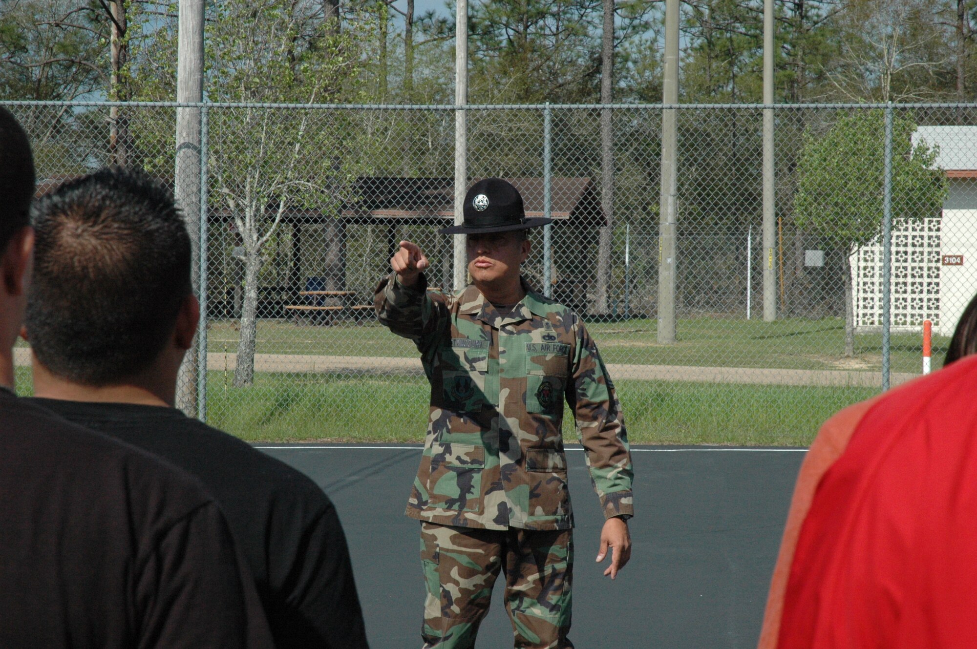 Senior Master Sgt. Steve Betancourt, 96th Medical Squadron. Eglin Air Force Base, calls out a specific recruit participating in the delayed entry program at Duke Field. Senior Master Sgt. Betancourt, a prior MTI of four years, volunteered his time during the April unit training assembly  to speak to recruits in the delayed entry program and give them a taste  of what they will experience in their first few hours arriving at basic military training, Lackland AFB, Texas. The program maintains contact with recruits awaiting their ship date to BMT while ensuring they are in compliance with the Air Force Reserve standards.  It also gives them the information and motivation to have a smoother transition from civilian to military life. (U.S. Air Force photo/ Senior Airman Jon McCallum)