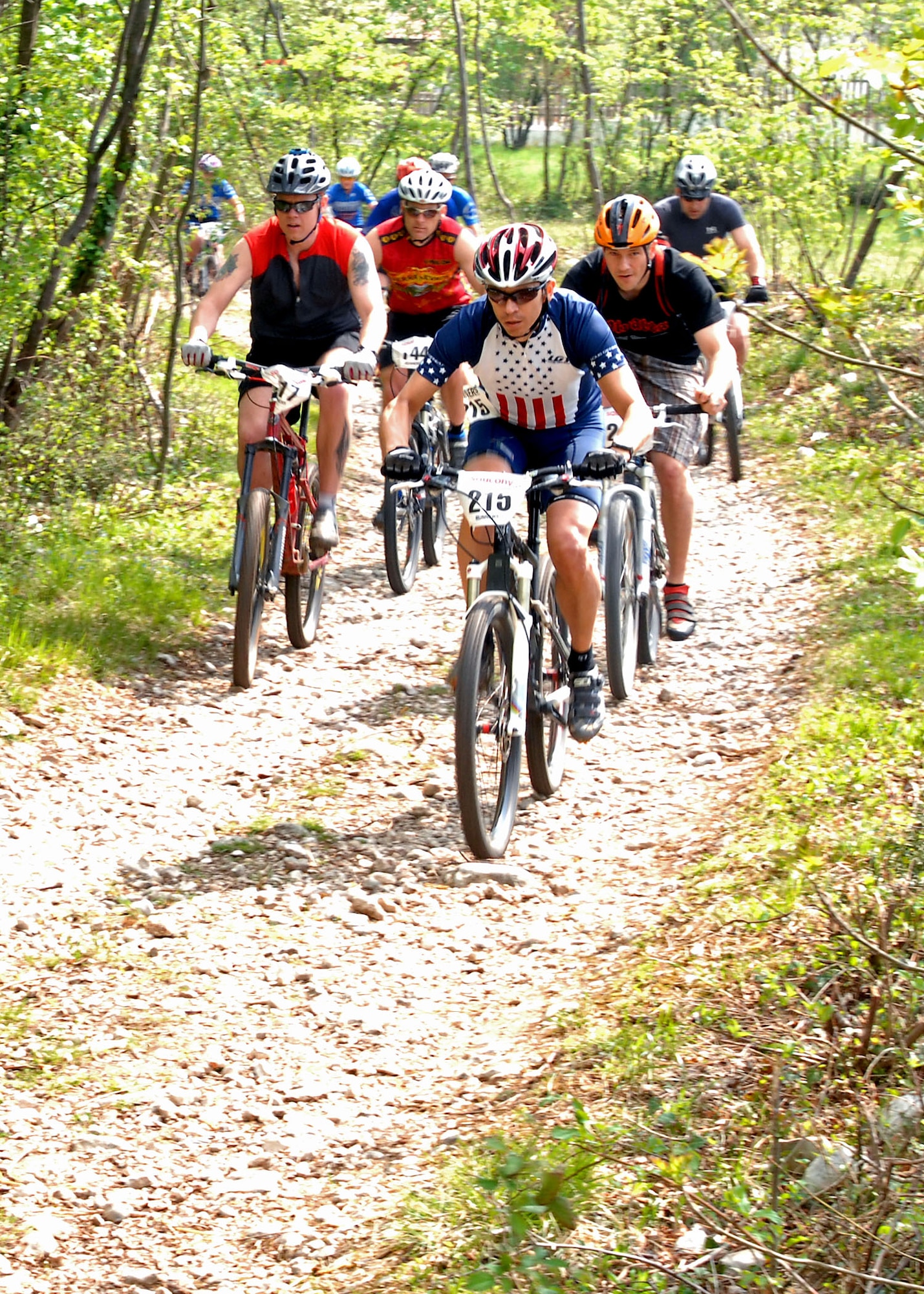 Competitive and novice mountain bikers round the first turn of a 6.25 kilometer loop at Camp Delta located at the base of the Dolomite Mountains near Aviano, Italy on April 18.  Eighteen riders from Germany and Italy took part in the first of 11 events which make up the 2009 U.S. Forces Europe Mountain Bike Series.  The championship race at U.S. Army Garrison in Hohenfels, Germany, Sept. 26 will close out the season.  (U.S. Air Force photo/Tech. Sgt. Michael O'Connor)
