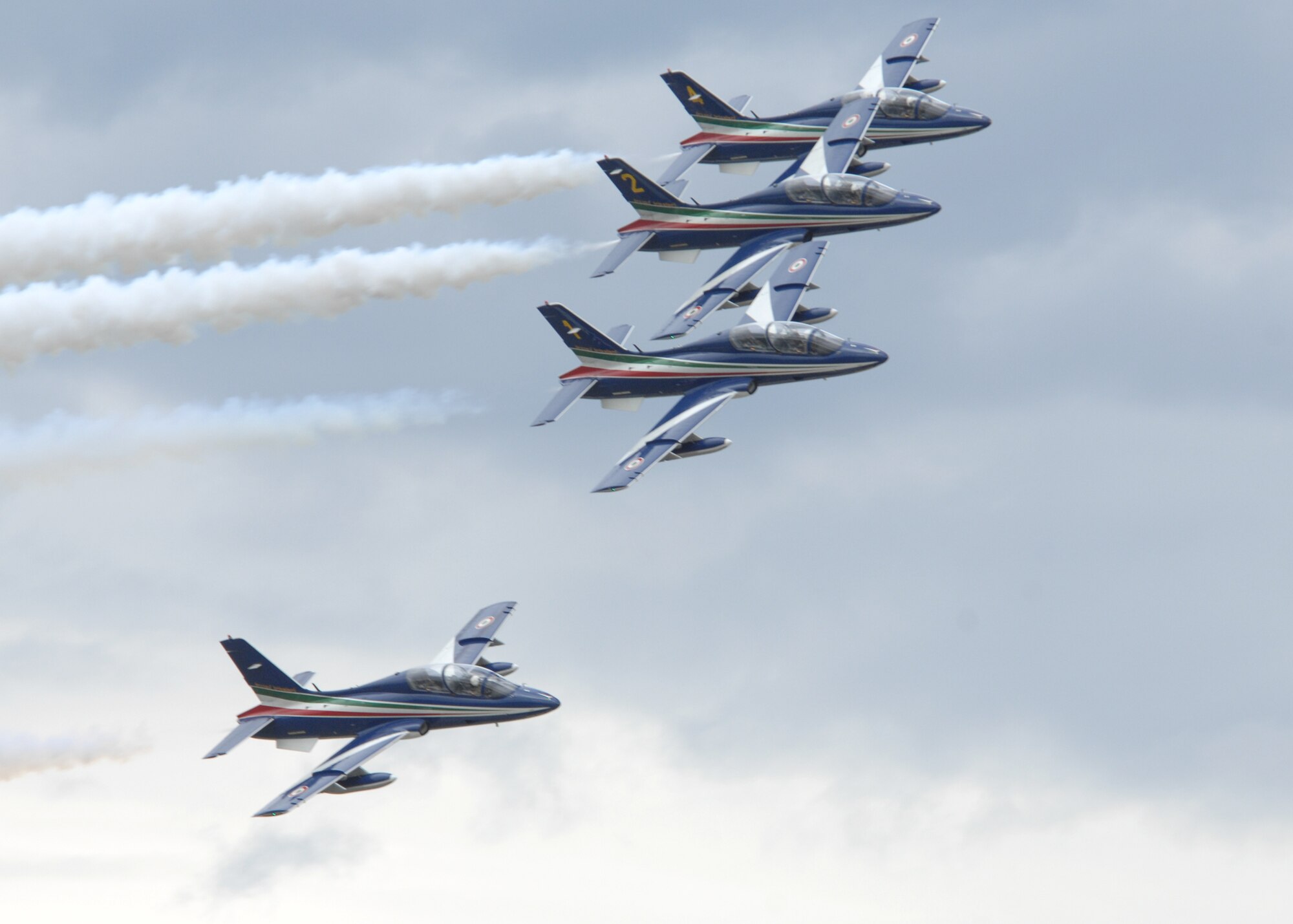 The Frecce Tricolori Italian air force aerobatics team practices their newest flying formations over the skies of Aviano on April 21.  Frecce Tricolori literally translates to tricolored arrows. It is the world's largest military aerobatic team and is regarded by many as being one of the most prestigious. The team was practicing for the start of the upcoming air show season that kicks off May 1 in Rivolto, Italy near Udine. The Frecce Tricolori aerobatics team is made up of ten Aermacchi MB-339-A/PAN aircraft from the Italian air force. The Aermacchi is a two-seater fighter-trainer and anti-tank aircraft capable of flying roughly 898 kilometers-per-hour at sea level. (U.S. Air Force photo/Airman 1st Class Tabitha M. Mans)