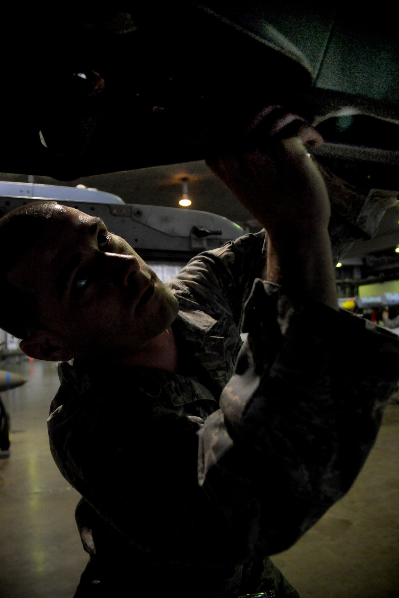 MISAWA AIR BASE, Japan -- Airman 1st Class Daniel Norfleet, 35th Aircraft Maintenance Squadron weapons-load crew member, prepares an F-16 Fighting Falcon during a weapons-load competition April 10, 2009. Airman Norfleet prepared the aircraft before munitions were loaded. (U.S. Air Force photo by Senior Airman Jamal D. Sutter)