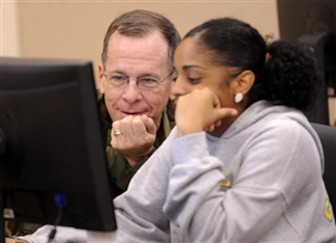 Chairman of the Joint Chiefs of Staff Adm. Mike Mullen (left), U.S. Navy, talks with Nain Gomez about online college courses during his visit to the Warrior and Family Support Center at Fort Sam Houston in San Antonio, Texas, on April 17, 2009.  Gomez is doing schoolwork while visiting her brother who is recovering at the Brooke Army Medical Center at Fort Sam Houston after being wounded by an improvised explosive device.  