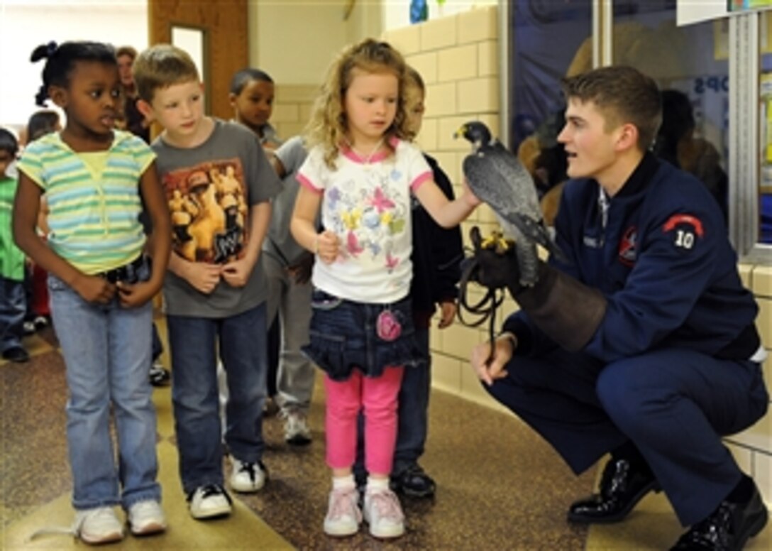 U.S. Air Force Academy Cadet Ryan Kerns, a falconer, introduces school children to the academy's school bird and ambassador, Havoc, a Peregrine falcon, during a visit to Alfred Forrest Elementary School in Hampton, Va., on April 20, 2009.  Kerns and Havoc are visiting area schools during Air Force Week to educate students about the Air Force.  