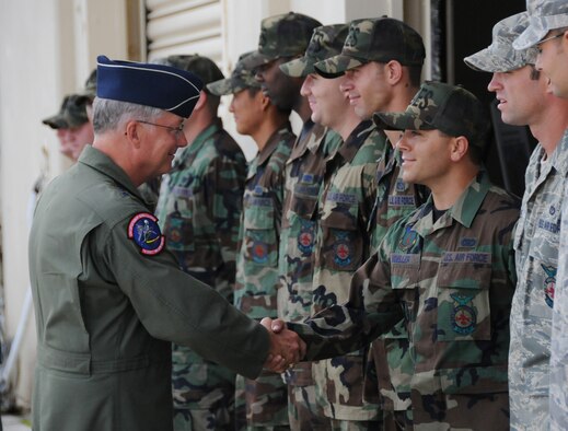 4/22/2009 -- ANDERSEN AIR FORCE BASE, Guam -- Lt. Gen. Chip Utterback, Commander, 13th Air Force (left), shakes hands with Staff Sgt. Eric Moeller, a firefighter from the 36th Civil Engineer Squadron, during a visit to Andersen AFB Apr. 22.  The 36th Wing here at Andersen is one of two wings assigned to 13th Air Force.  (U.S. Air Force photo/ Senior Amn Jonathan Hart) RELEASED