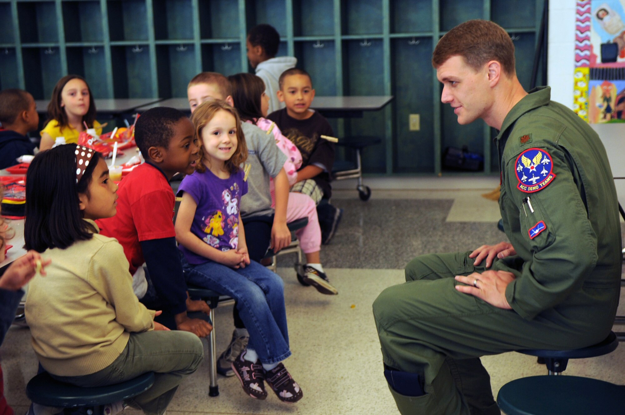 LANGLEY AIR FORCE BASE, Va. -- Maj. Dave "Zeke" Skalicky, F-22A Raptor Demonstration Team pilot, meets students  at Thalia Elementary School in Virginia Beach April 22. The F-22 Demonstration Team visited schools throughout the local community as a part of Hampton Roads Air Force Week activities. This week is a chance to tell their Air Force story, showcase warfighting capabilities and thank the community for their support.  (U.S. Air Force photo/Staff Sgt. Tabitha Kuykendall)