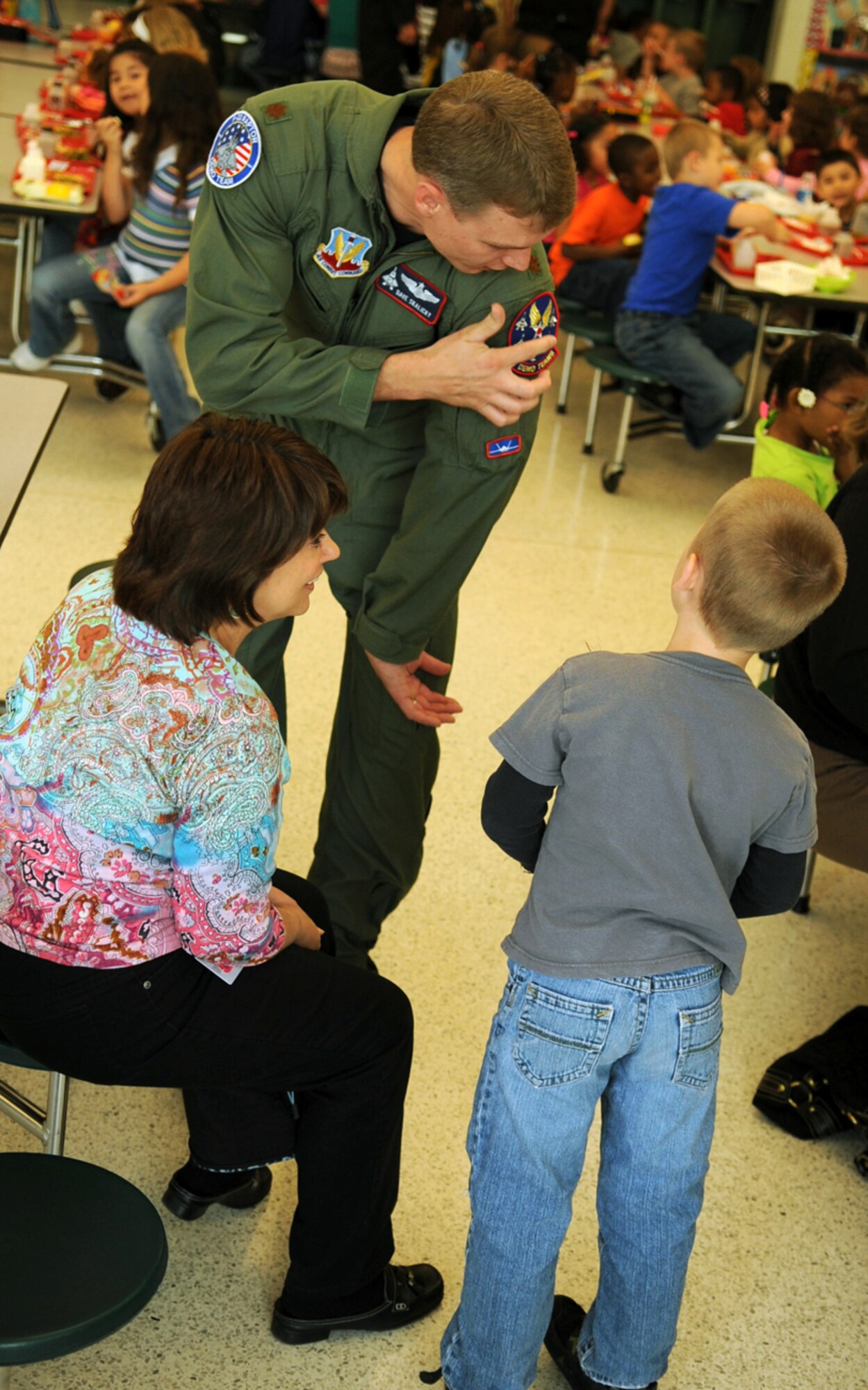 LANGLEY AIR FORCE BASE, Va. -- Maj. Dave "Zeke" Skalicky, F-22A Raptor Demonstration Team pilot, answers questions from students at Thalia Elementary School in Virginia Beach April 22.  The F-22 Demonstration Team visited schools throughout the local community as a part of Hampton Roads Air Force Week activities. This week is a chance to tell their Air Force story, showcase warfighting capabilities and thank the community for their support.  (U.S. Air Force photo/Staff Sgt. Tabitha Kuykendall)