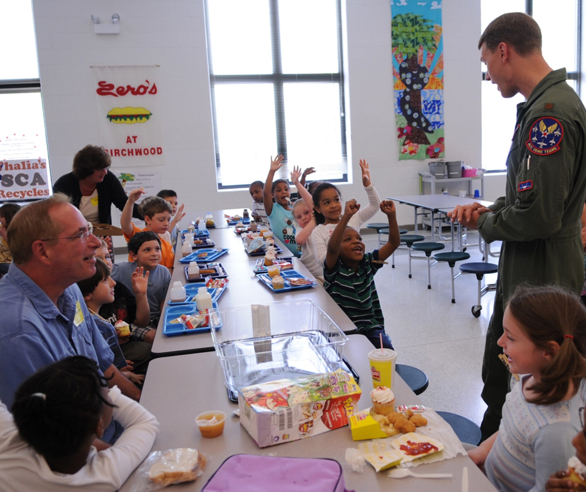 LANGLEY AIR FORCE BASE, Va. -- Maj. Dave "Zeke" Skalicky, F-22A Raptor Demonstration Team pilot, visit students at Thalia Elementary School in Virginia Beach April 22.  The F-22 Demonstration Team visited schools throughout the local community as a part of Hampton Roads Air Force Week activities. This week is a chance to tell their Air Force story, showcase warfighting capabilities and thank the community for their support.  (U.S. Air Force photo/Staff Sgt. Tabitha Kuykendall)