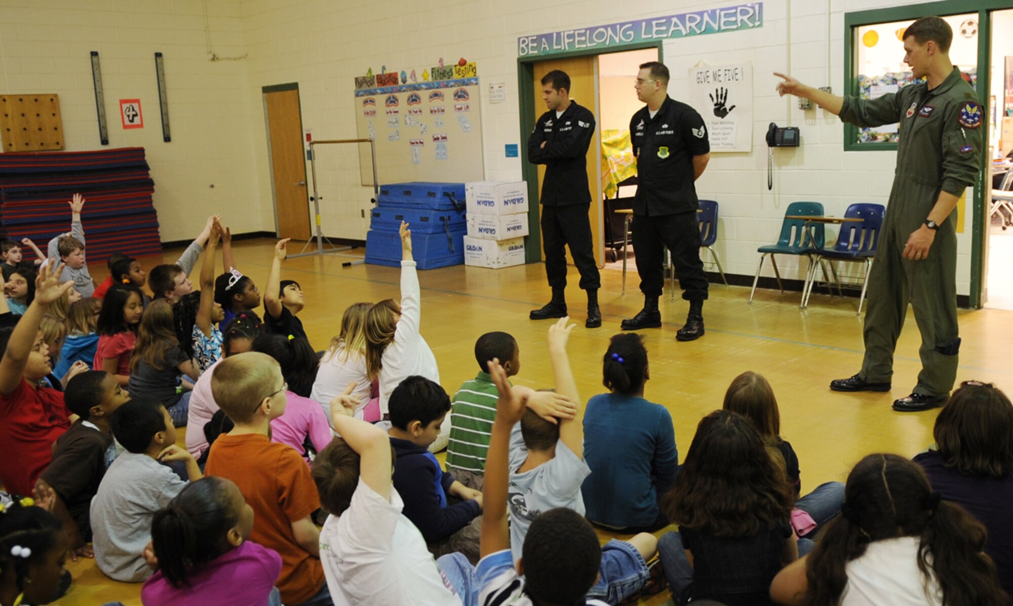 LANGLEY AIR FORCE BASE, Va. -- Maj. Dave "Zeke" Skalicky, F-22A Raptor Demonstration Team pilot, answers questions from third graders at Thalia Elementary School in Virginia Beach April 22.  The F-22 Demonstration Team visited schools throughout the local community as a part of Hampton Roads Air Force Week activities. This week is a chance to tell their Air Force story, showcase warfighting capabilities and thank the community for their support.  (U.S. Air Force photo/Staff Sgt. Tabitha Kuykendall)
