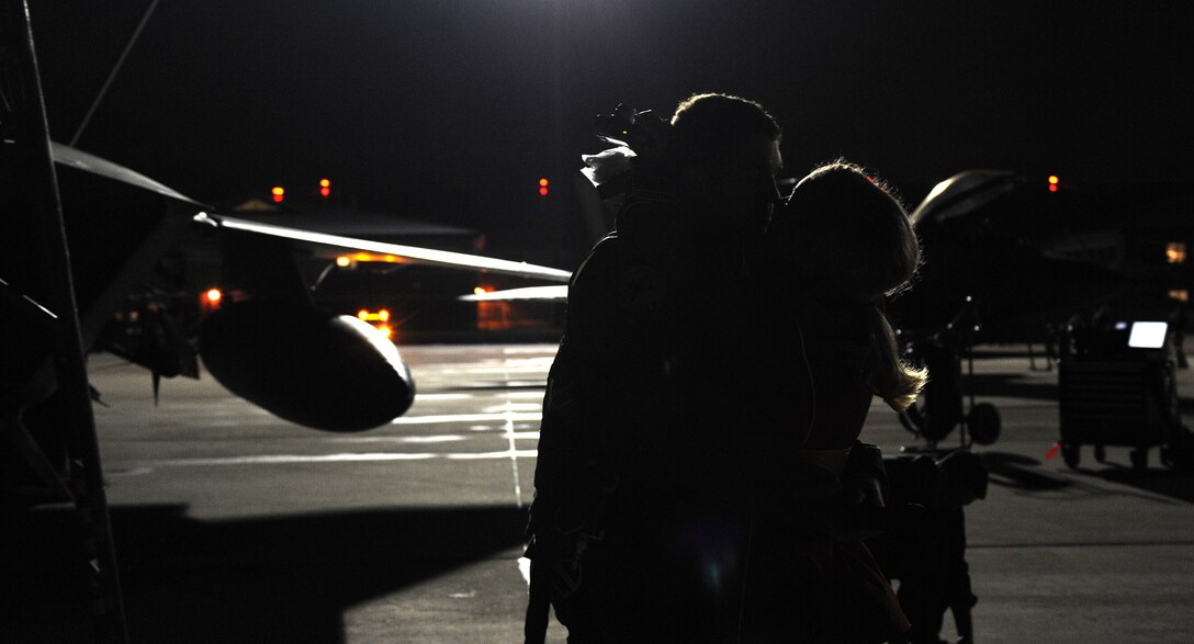 LANGLEY AIR FORCE BASE, Va. -- Tara Heuermann welcomes home her fiancé, Capt. Jonathan Airhart, F-22A Fighter Squadron pilot, after returning from his deployment. More than 500 Airmen returned after a 120-day deployment to Kadena Air Base, Japan where they worked with the Japanese Air Self Defense Force. (U.S. Air Force photo/Airman 1st Class Zachary Wolf)