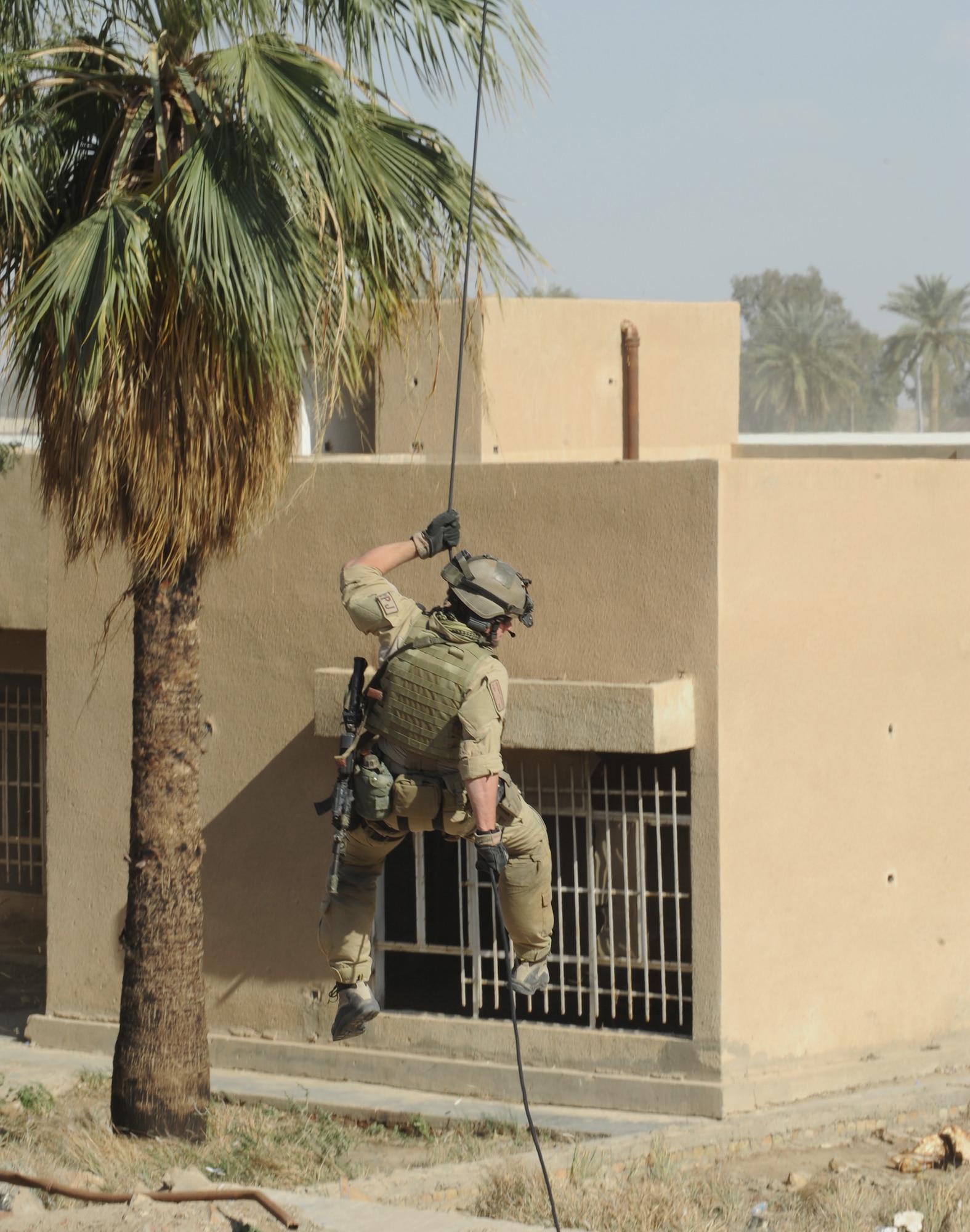 Senior Airman Matthew Street rappels from an HH-60 Pave Hawk helicopter April 10 during a proficiency exercise outside of Baghdad, Iraq. He is a pararescueman from the 64th Expeditionary Rescue Squadron at Joint Base Balad, Iraq. (U.S. Air Force photo/Staff Sgt. James L. Harper Jr.)
