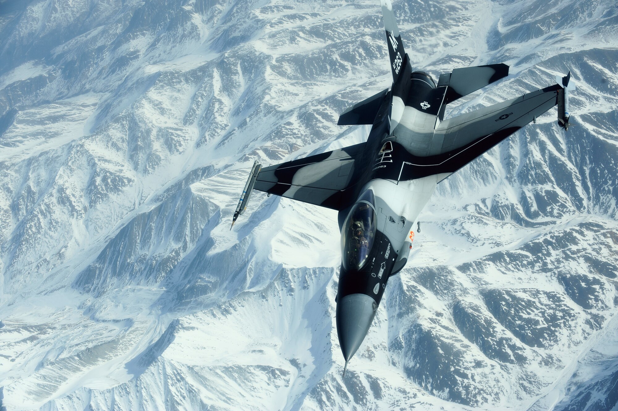 An F-16 Aggressor, 18th Aggressor Squadron, flies over the Joint Pacific Alaskan Range Complex during RED FLAG-Alaska 09-2 April 22, 2009, Eielson Air Force Base, Alaska. The Aggressors' role during RF-A expands training opportunities across the board, to include ground, space and cyberspace providing the most realistic simulated combat environment possible.  (U.S. Air Force Photo/Senior Airman Jonathan Snyder)