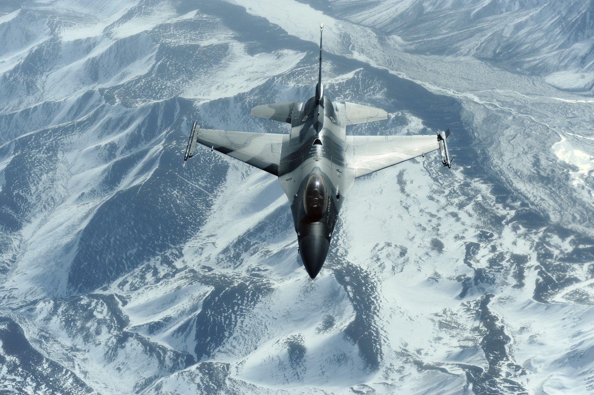 An F-16 Aggressor flies over the Joint Pacific Alaskan Range Complex during RED FLAG-Alaska 09-2 April 22, 2009, Eielson Air Force Base, Alaska. The JPARC provides 67,000 square miles of airspace, one conventional bombing range and two tactical bombing ranges containing more than 400 different types of targets and more than 30 threat simulators, both manned and unmanned. The F-16 is assigned to the 18th Aggressor Squadron.  (U.S. Air Force Photo/Senior Airman Jonathan Snyder)