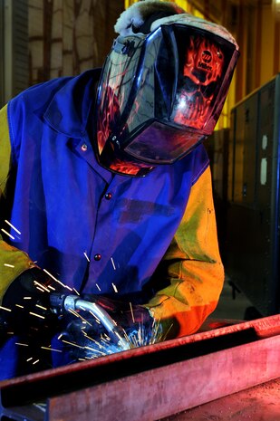 Airman 1st Class Ryan Foxx, a metals technician from the 57th Components Maintenance Squadron, welds a metal arc to be used for an engine stand, April 16, Nellis Air Force Base, Nev. The 57th CMS is responsible for the structural maintenance of all aircraft assigned to the 57th Wing. (U.S. Air Force photo by/Senior Airman Nadine Y. Barclay/RELEASED)