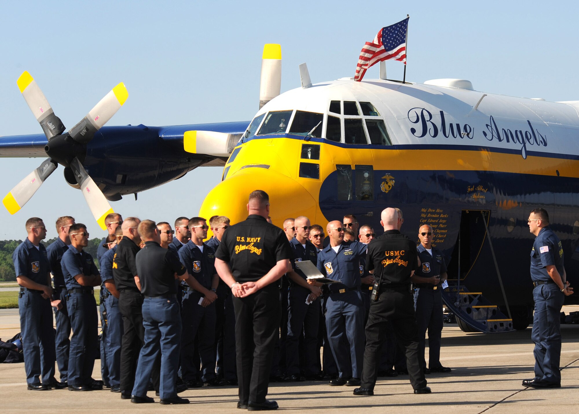 The U.S. Navy Blue Angels crew assemble on the flight line shortly after their arrival at Seymour Johnson Air Force Base, N.C., April 23, 2009. They will be the main attraction during the Wings over Wayne air show April 25 to 26. (U.S. Air Force photo by Senior Airman Makenzie Lang)