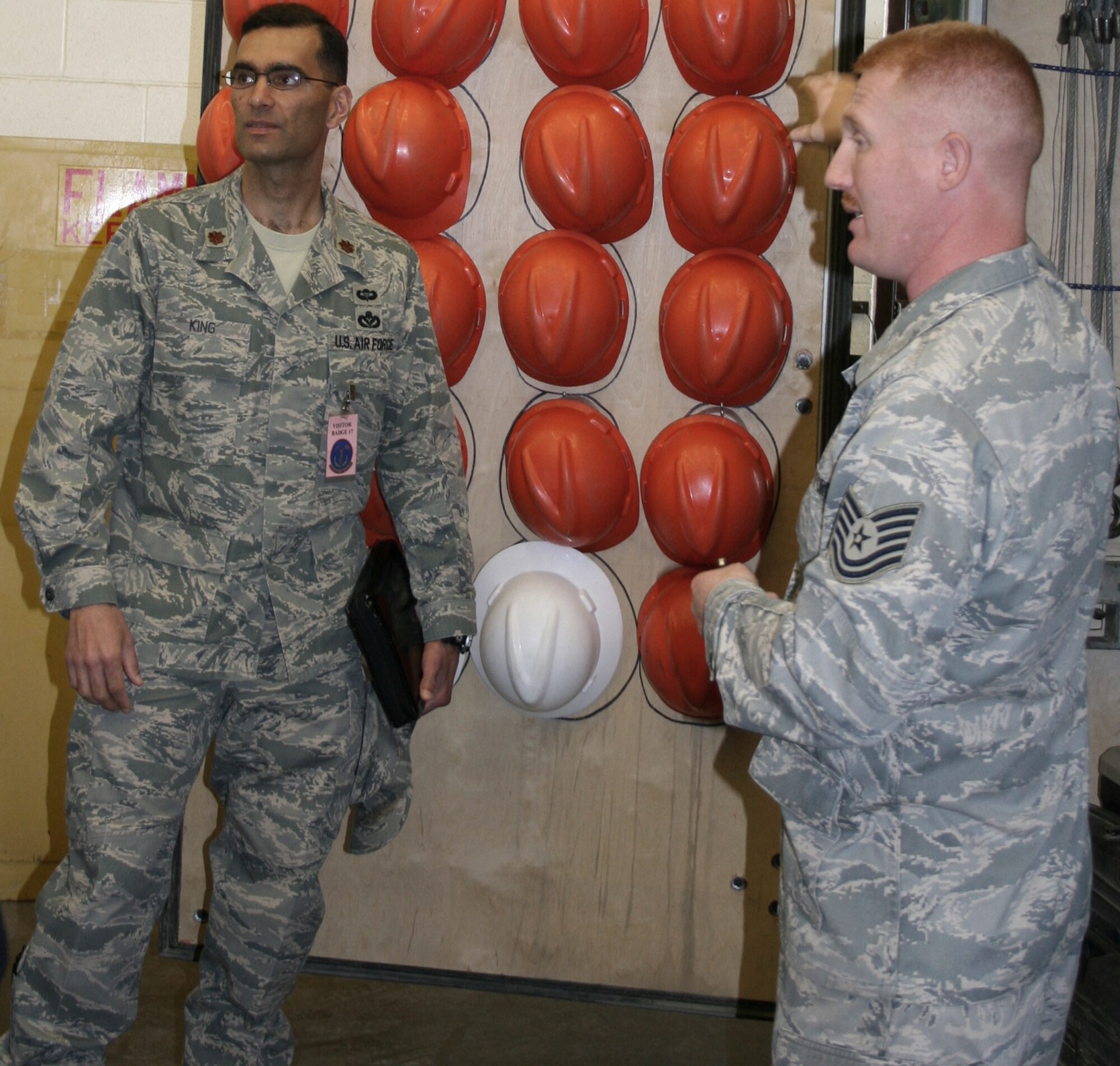 Maj. James King and Tech. Sgt. Joshua Horton inspect the mobility bins as part of a Rapid Improvement Event recently. The event was held March 30 thru April 3 as part of the Air Force Smart Operations of the 21 Century to help maximize value and minimize waste. Major King is a AFSO-21 facilitator-in-training. Sergeant Horton is assigned to the 9th Munitions Squadron. (U.S. Air Force photo) 