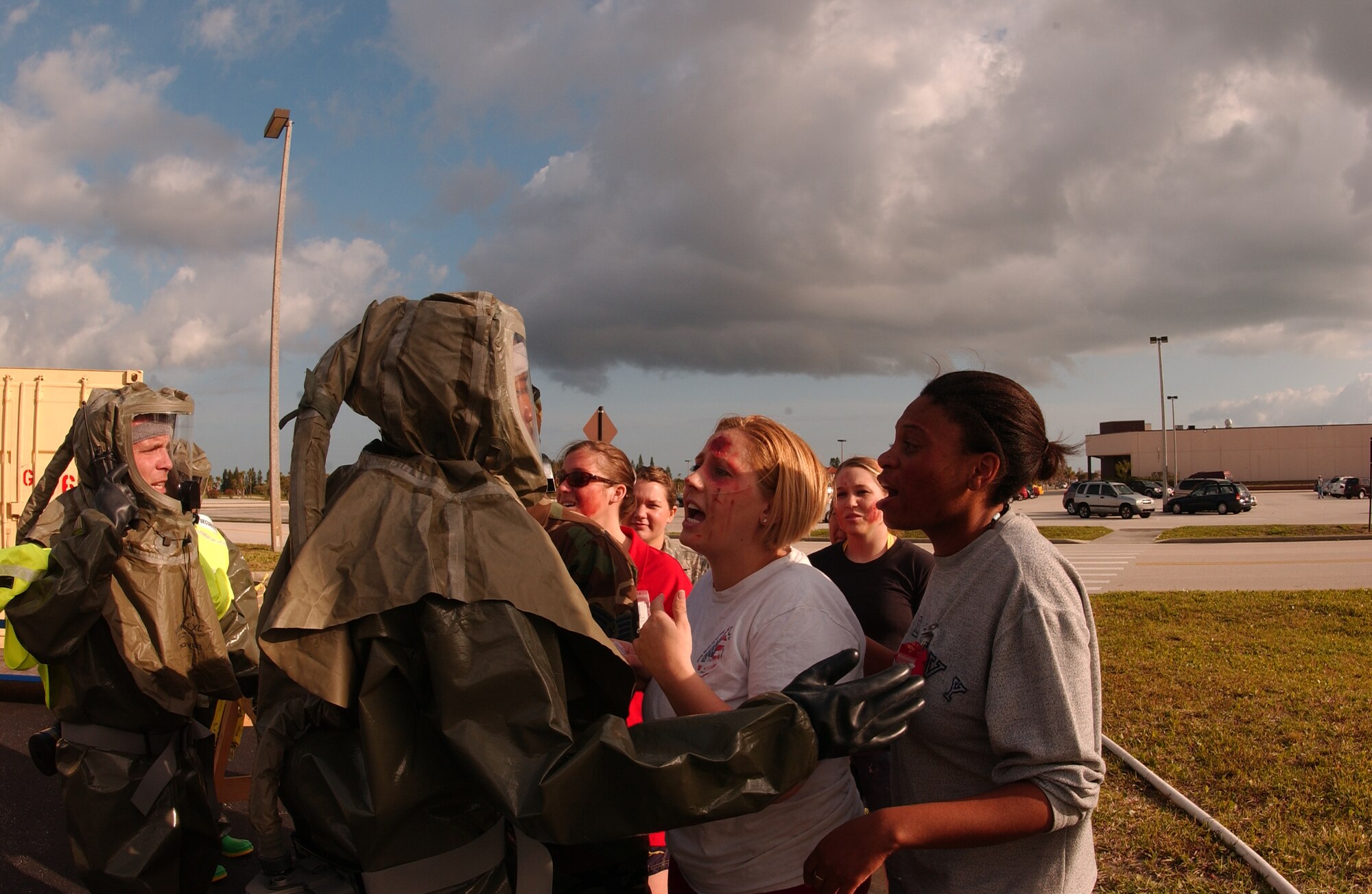 Combat Medics from the 45th Medical Group  demonstrate their robust homeland defense response capability during a simulated accident exercise April 17. Donning their protective gear, members of the In-Place Patient Decontamination Team respond to injured role players in front of the medical decontamination station. (U.S. Air Force photo/Master Sgt. Robert Burgess)