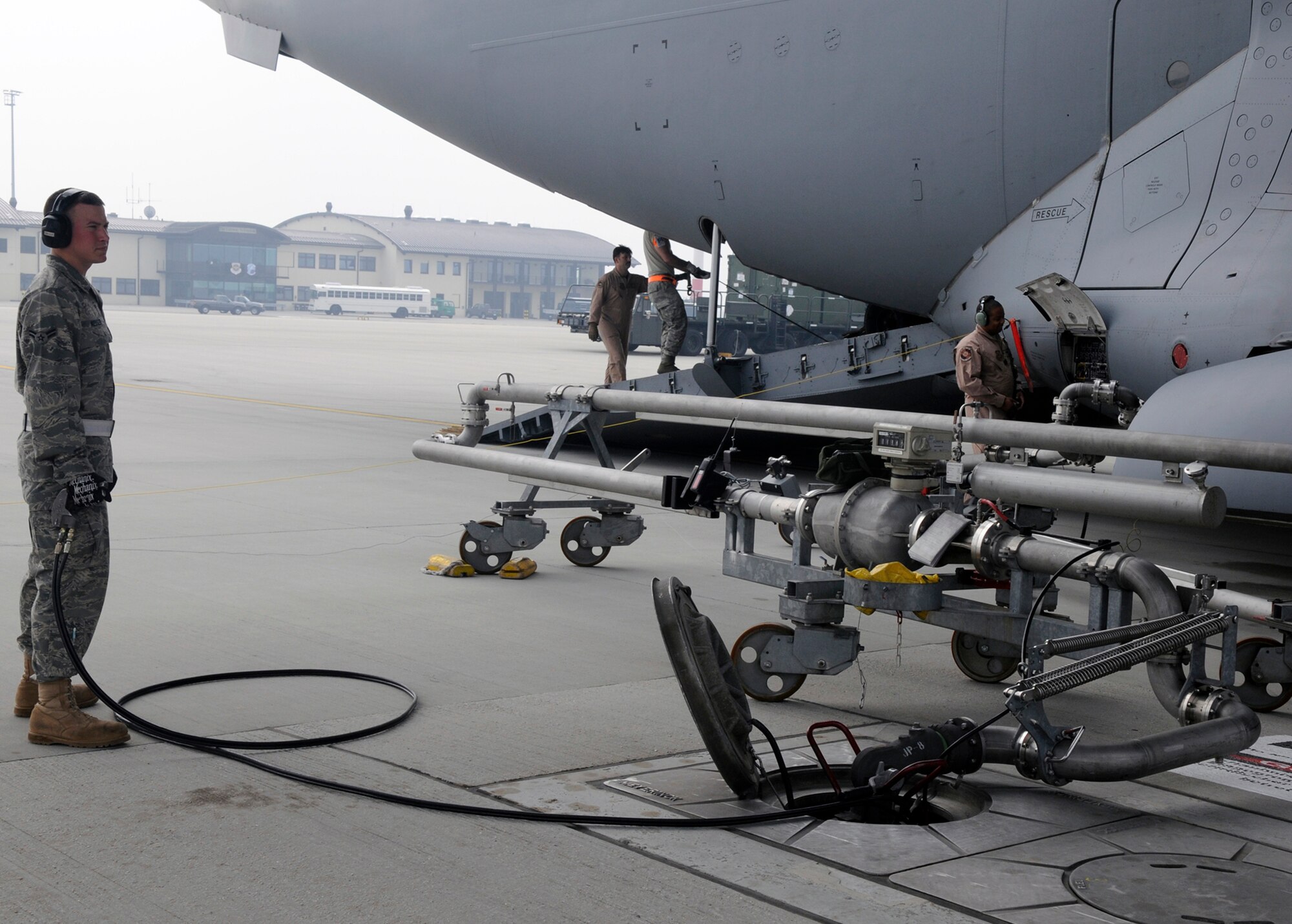 Airman 1st Class Adam Kessler assists in refueling a C-17 Globemaster at Spangdahlem Air Base, Germany, April 10. The 726th Air Mobility Squadron recently conducted an Air Force Smart Operations for the 21st Century value stream analysis, looking for ways to streamline C-17 refueling and increase proficiency levels. The team came up with 84 suggested technical order improvements, which they will submit through Air Force TO improvement channels. Airman Kessler is assigned to the 52nd Logistics Readiness Squadron. (U.S. Air Force photo/Airman 1st Class Staci Miller)