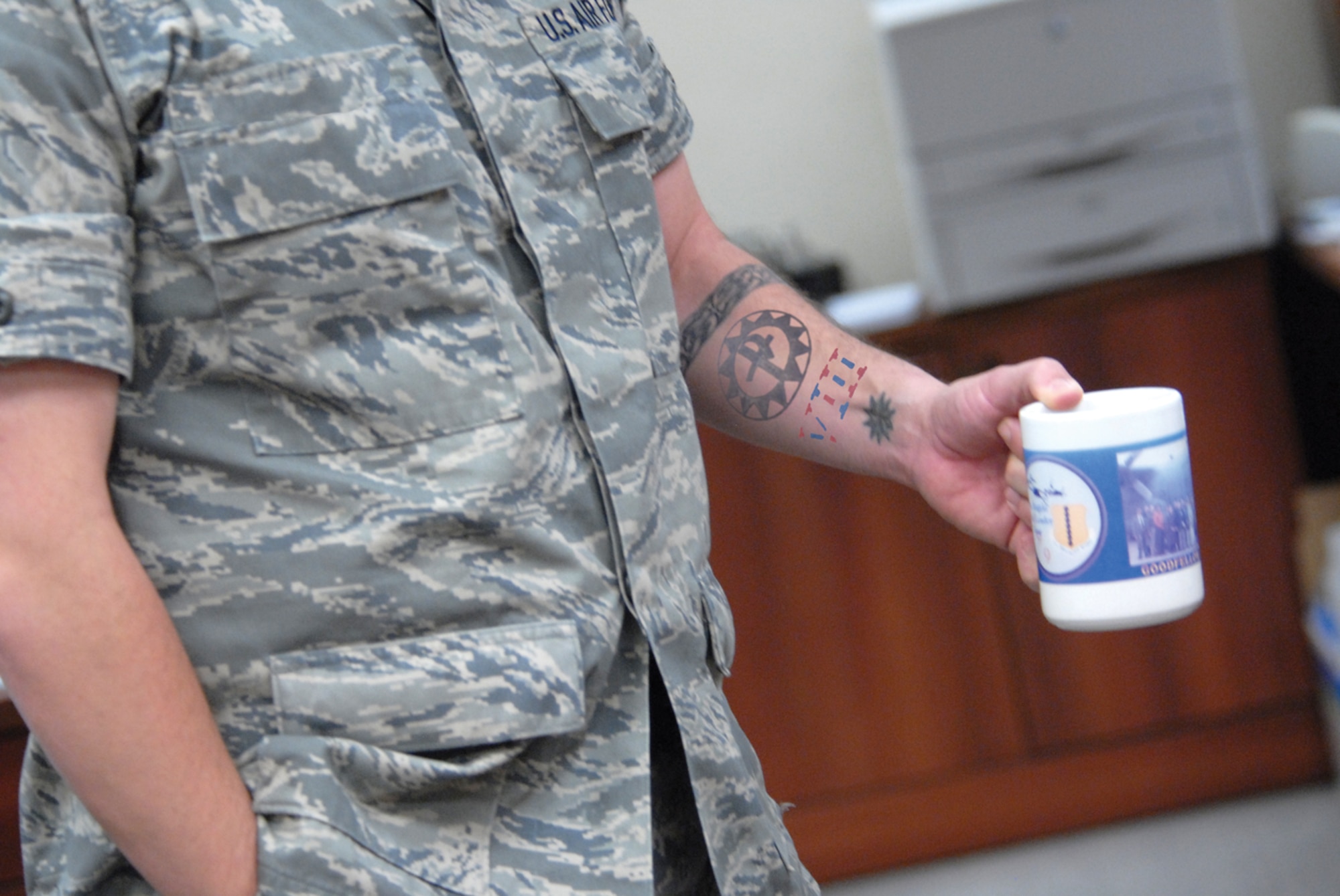 #7 Inappropriate tattoos
Excessive tattoos or brands will not be exposed or visible (includes visible through the uniform) while in uniform. An excessive tattoo or brand is defined as exceeding one quarter of the exposed body part and those above the collarbone and readily visible when wearing an open collar uniform. The display of excessive tattoos detracts from maintaining an appropriate professional image while in uniform. Members not meeting the acceptable image should be required to maintain complete coverage or removal of the tattoo. Members who choose not to comply with the standard may be subject to the same punishment as not removing an unauthorized tattoo. For more information, see AFI 36-2903 Table 2.5, Line 2.  (U.S. Air Force photo illustration)
