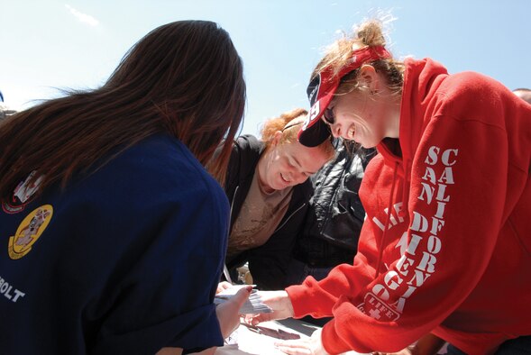 Melissa Rickabaugh and Janelle Donovan waited in line for two hours to get free tickets to the Subway Fresh Fit 500 NASCAR Sprint Cup Series. “I love NASCAR!” said Ms. Rickabaugh. (U.S. Air Force photo/ Deborah Silliman Wolfe)