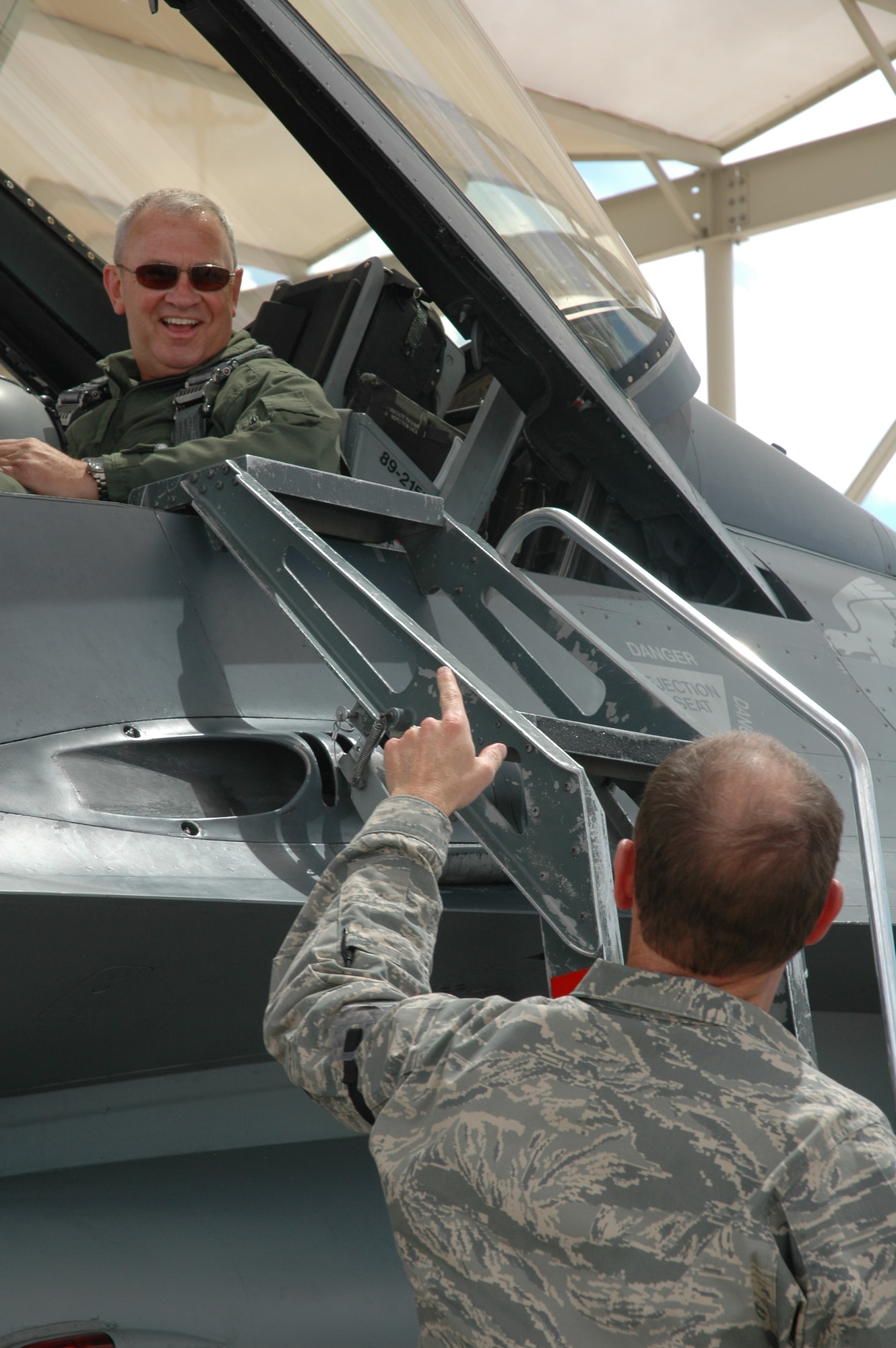Master Sgt. Chris Ames, 944th Logistics Readiness Squadron first sergeant, smiles as Lt. Col. Paul Theisen, 944th LRS commander, wishes him good luck prior to take off for his incentive flight April 22. Sergeant Ames received the incentive flight on his last day of duty before retirement after 21 years of military service. In May 2008, Sergeant Ames deployed for four months to the 455th Air Expeditionary Wing at Bagram Air Field, Afghanistan, where he served as first sergeant for the 755th Air Expeditionary Group. During that time, he visited Airmen on 41 combat missions to 21 separate austere locations throughout Afghanistan by traveling more than 4,000 miles by air and ground assault convoys. (U.S. Air Force photo/Tech. Sgt. Susan Stout)