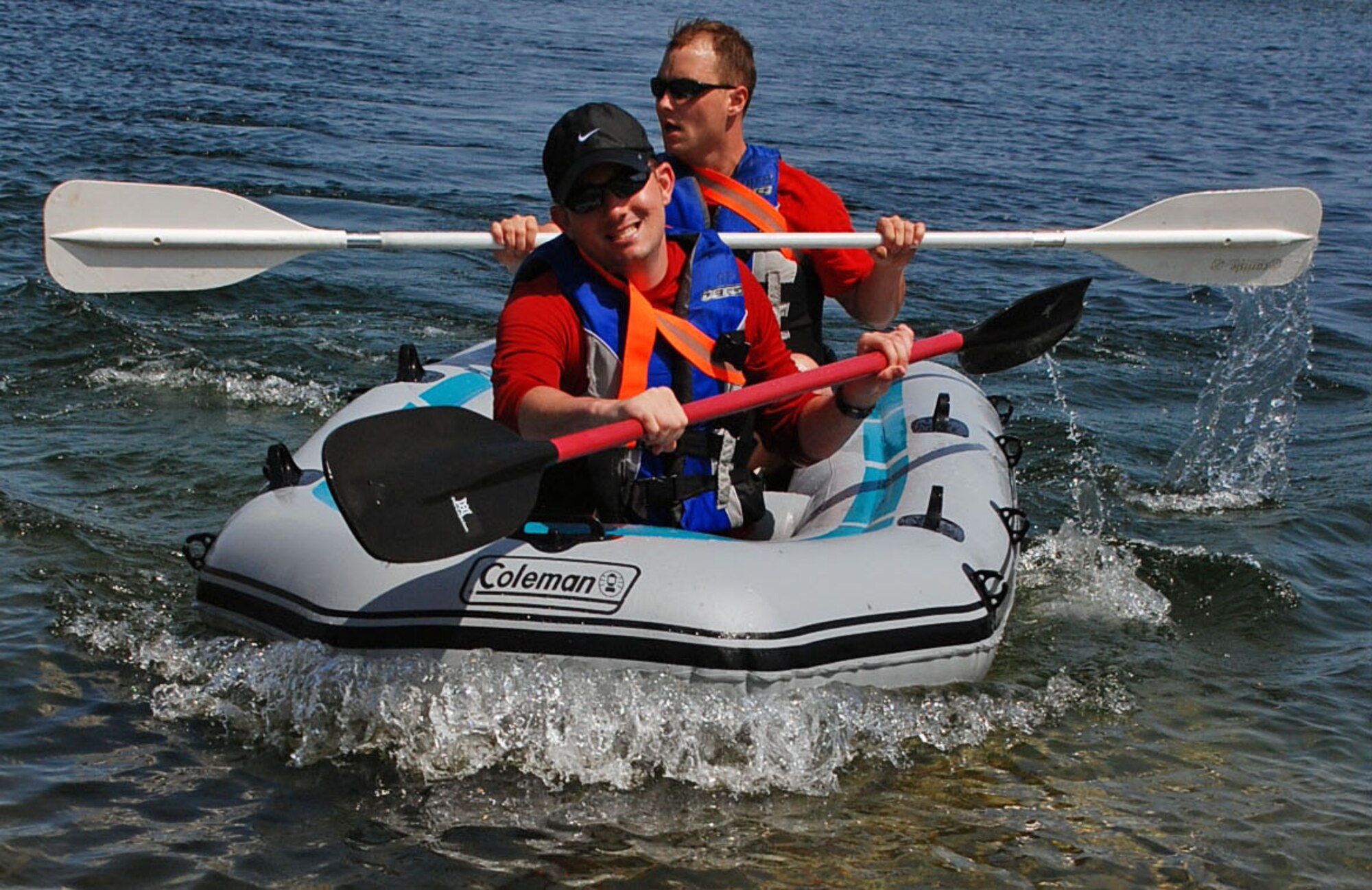 LAUGHLIN AIR FORCE BASE, Texas -- Two members of a relay team paddle to shore during the 2-mile rafting portion of the 35-mile Adventure Race V held here April 18. (U.S. Air Force photo by Airman 1st Class Sara Csurilla)