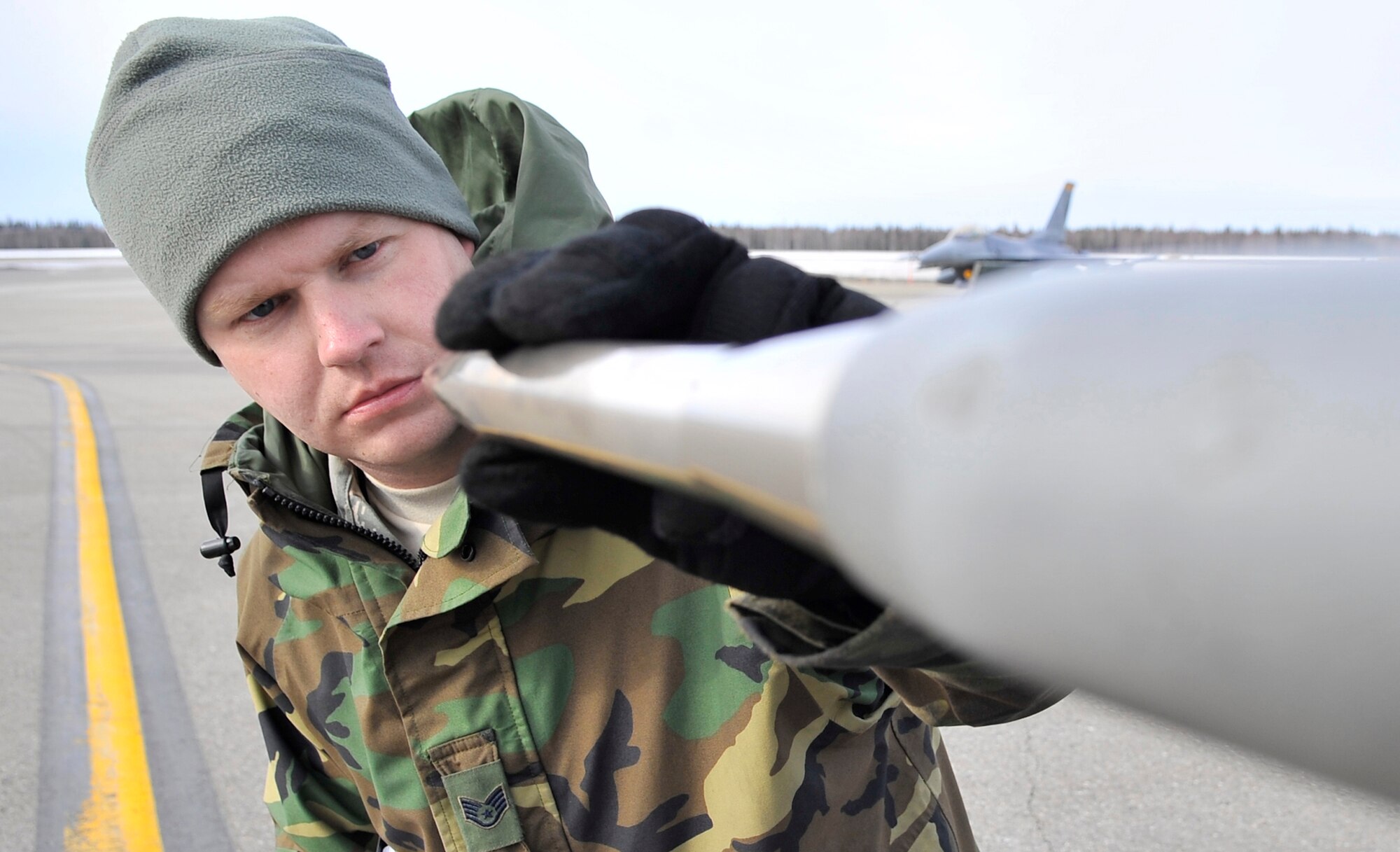 Staff Sgt. James George inspects a pitot tube on an F-16 Fighting Falcon for dents and debris April 17 during Red Flag-Alaska at Eielson Air Force Base, Alaska. Red Flag-Alaska is a Pacific Air Forces-directed field training exercise for U.S. and coalition forces who fly under simulated air-combat conditions. Sergeant George is a crew chief assigned to the Iowa Air National Guard's 132nd Fighter Wing from Des Moines.  (U.S. Air Force photo/Senior Airman Christopher Boitz) 