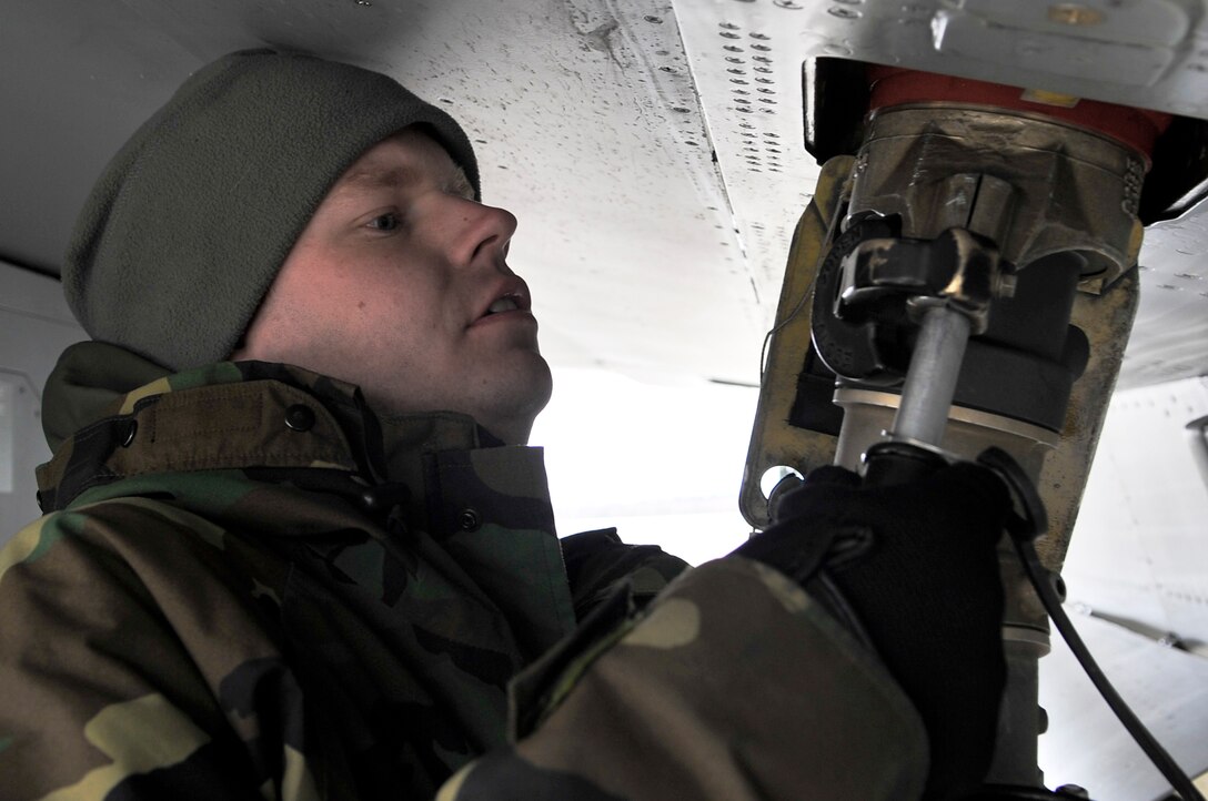 Staff Sgt. James George prepares to fuel an F-16 Fighting Falcon April 17 during Red Flag-Alaska at Eielson Air Force Base, Alaska. Red Flag-Alaska is a Pacific Air Forces-directed field training exercise for U.S. and coalition forces who fly under simulated air-combat conditions. Sergeant George is a crew chief from the Iowa Air National Guard's 132nd Fighter Wing from Des Moines.  (U.S. Air Force photo/Senior Airman Christopher Boitz)