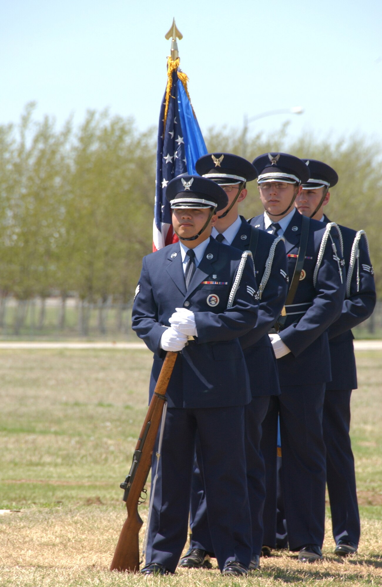Members of the Vance Honor Guard stand ready to present the colors at the Vance Arbor Day ceremony. (U.S. Air Force photo by Staff Sgt. Brian Hill)