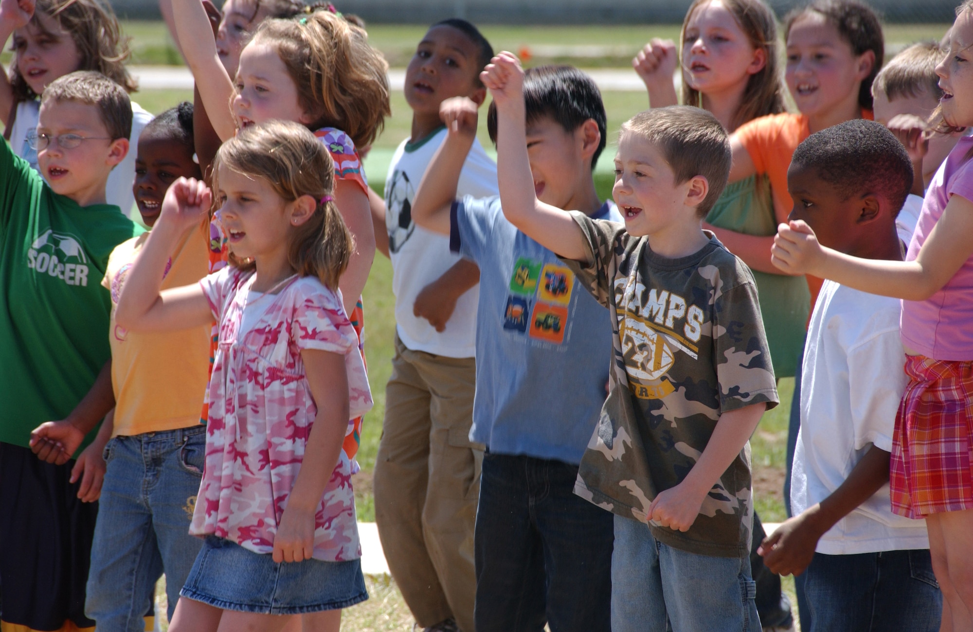 Eisenhower Elementary School first and second graders sing songs at the Vance Airbor Day ceremony. (U.S. Air Force photo by Staff Sgt. Brian Hill)