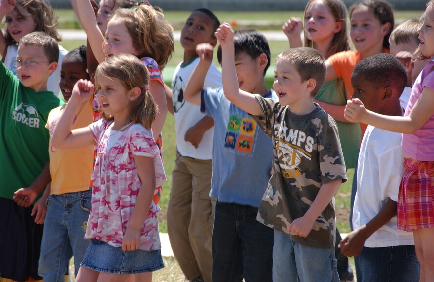 Eisenhower Elementary School first and second graders sing songs at the Vance Airbor Day ceremony. (U.S. Air Force photo by Staff Sgt. Brian Hill)