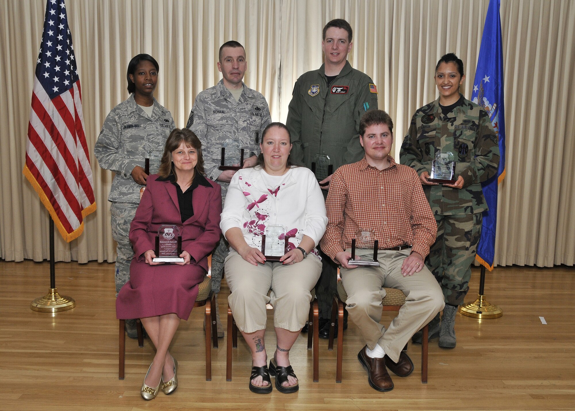 The first quarter 2009 Quarterly Award Winners were announced at a breakfast at the Grizzly Bend Club April 21. The winners are, seated left to right: Civilian Category I Elizabeth Mackinstadt; Civilian Category II Jennifer Robinson, Civilian Supervisor Category II Justin Pleinis. Back row, left to right: Airman of the Quarter Airman 1st Class Jasmin Bell; Senior NCO of the Quarter Master Sgt. WIlliam Schaal; Company Grade Officer of the Quarter 1st Lt. Robert Wray; and Honor Guard Memeber of the Quarter Senior Airman Virgina Garcia. Not pictured are Civilian Supervisor Category I Michael Morhardt and NCO of the Quarter Tech. Sgt. William Schaal. (U.S. Air Force photo/John Turner)