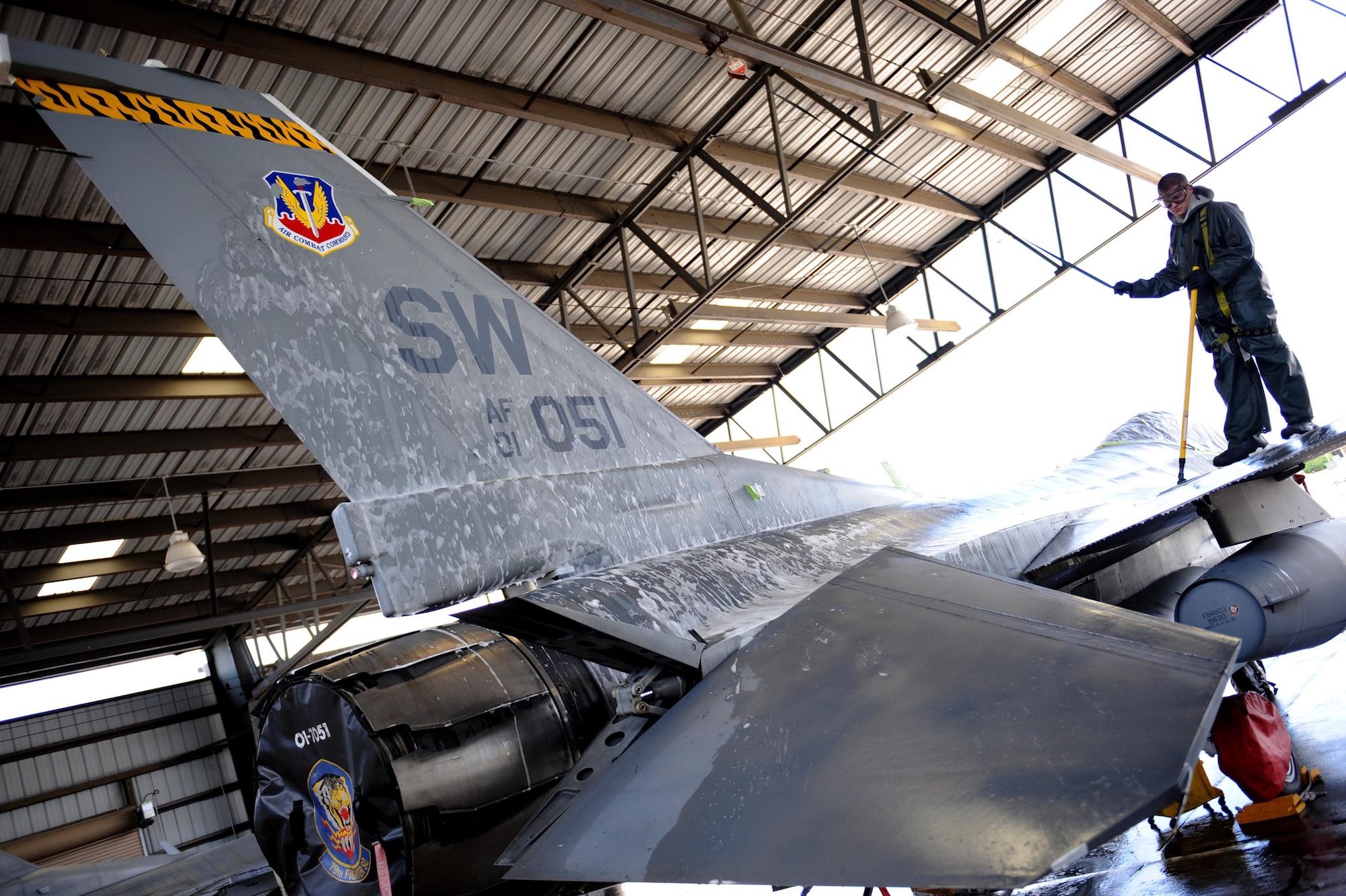 SHAW AIR FORCE BASE, S.C. -- Airman 1st Class Marcus Floyd, 20 Equipment Maintenance Squadron armament specialist,washes an F-16 Fighting Falcon jet from the 79th Fighter Squadron during an aircraft wash April 20, 2009. Airmen from the 20th Maintenance Group are participatingin an Air Force Smart Operartions of the 21st Century rapid improvement event to enhance wash rack operations for F-16 aircraft.(U.S. Air Force photo/Senior Airman Matt Davis)