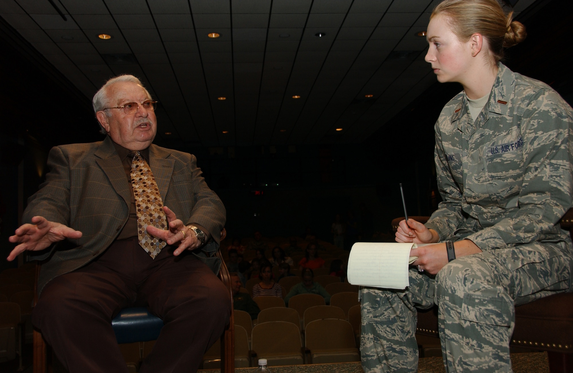 2nd Lt. Katherine Roling, 71st Flying Training Wing Public Affairs, interviews Holocaust survivor Jack Mandelbaum April 21 prior to him speaking about his experiences in labor and concentration camps run by the Nazis. About 200 Vance Airmen and their families attended the event at the base auditorium, honoring Holocaust Remembrance Day. (U.S. Air Force photo by Staff Sgt. Brian Hill)                               