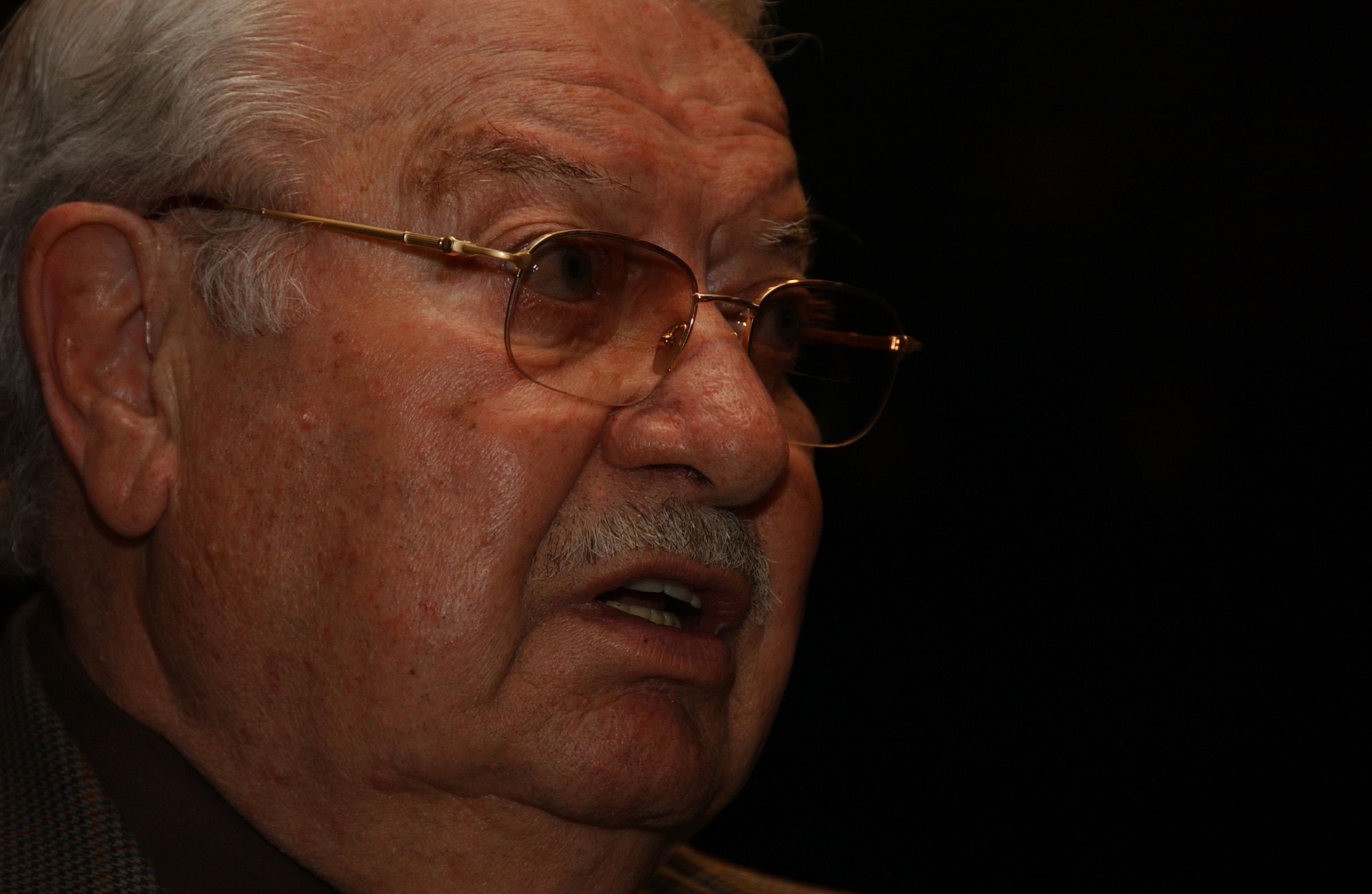 Holocaust survivor Jack Mandelbaum is interviewed by local news media April 21 prior to speaking about his experiences in labor and concentration camps run by the Nazis. About 200 Vance Airmen and their families attended the event at the base auditorium, honoring Holocaust Remembrance Day. (U.S. Air Force photo by Staff Sgt. Brian Hill)