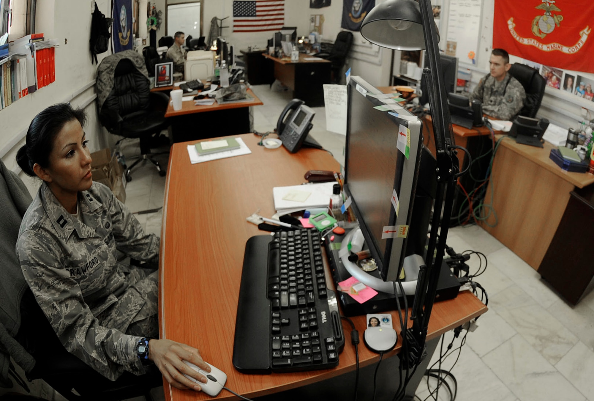 Capt. Sophia Crawford works three different sides of the law in her position as the detention, judicial and legal policy attorney in the Multi-National Force-Iraq's Office of the Staff Judge Advocate. She is the U.S. legal representative providing feedback on how the Iraq detention facilities are performing with regard to legal issues. (U.S. Air Force photo/Senior Jacqueline Romero) 
