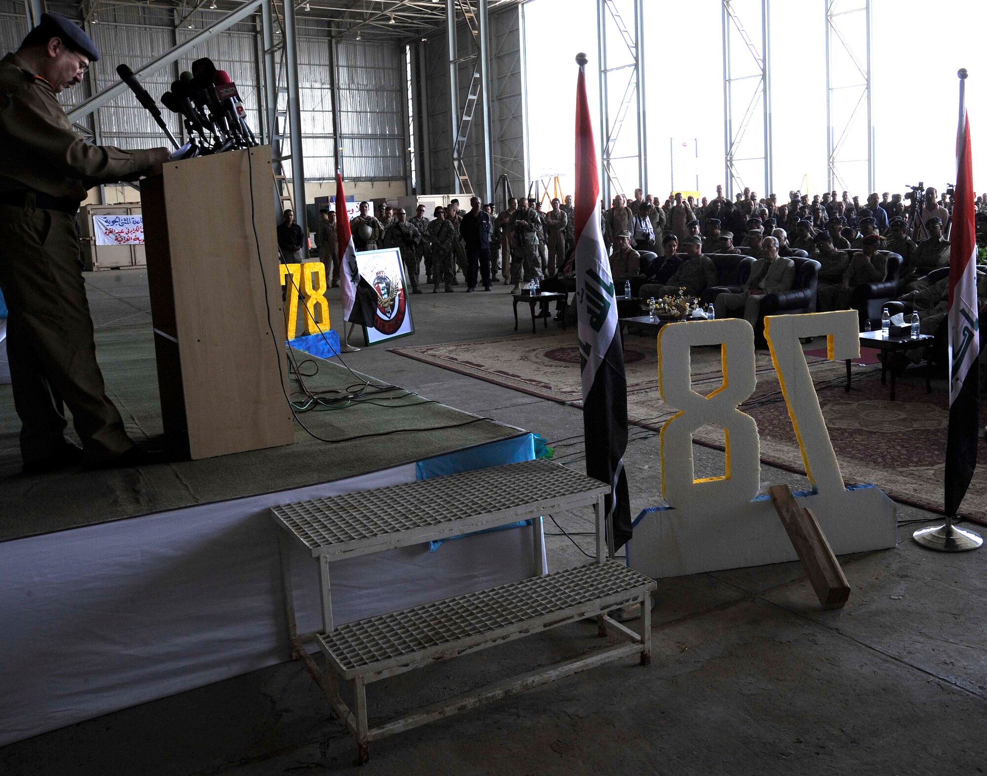 Airmen and Iraqi military members attend the 78th annual Iraqi Air Day April 22 at New al-Muthana Air Base, Iraq.  Iraqi officials spoke to the large crowd on how far the Iraqi air force has come in the past few years.  There were also static displays of Iraqi aircraft on display. (U.S. Air Force photo/Senior Airman Jacqueline Romero)
