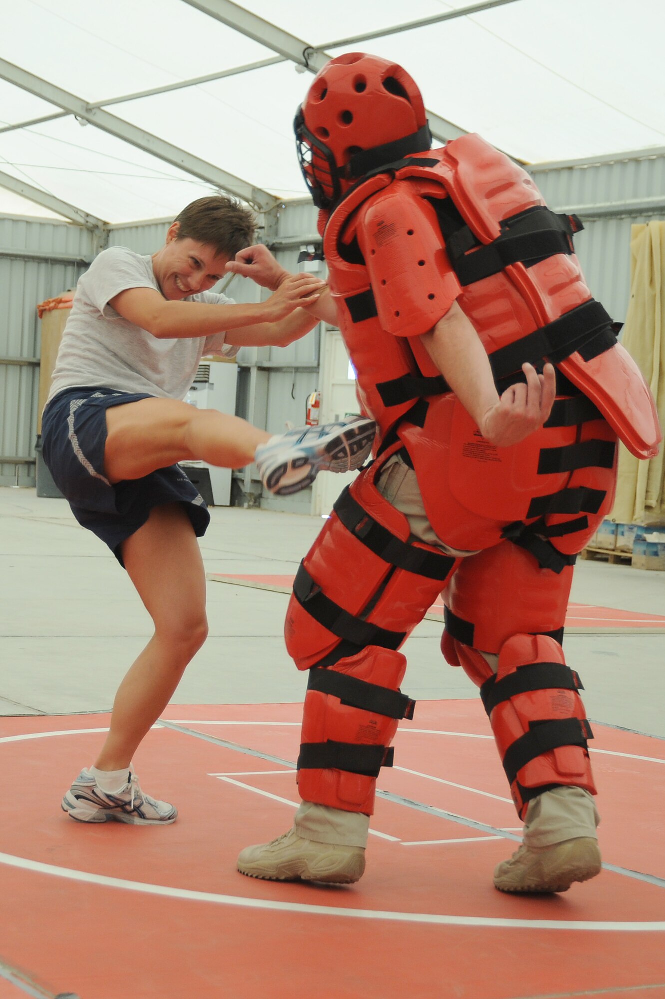 Master Sgt. Malinda Kingsley, 380th Expeditionary Maintenance Squadron, fights off an attacker played by Mr. Rick Baldwin, a Northrop Grumman contractor during self-defense training, April 18 at an undisclosed location in Southwest Asia. The Sexual Assault Response Coordinator (SARC) sponsored the training that gave students the chance to learn techniques to defend themselves from attack. Sergeant Kingley is deployed from Grand Forks AFB, N.D. and hails from Morgan, Minn. (U.S. Air Force photo by Senior Airman Brian J. Ellis) (Released)