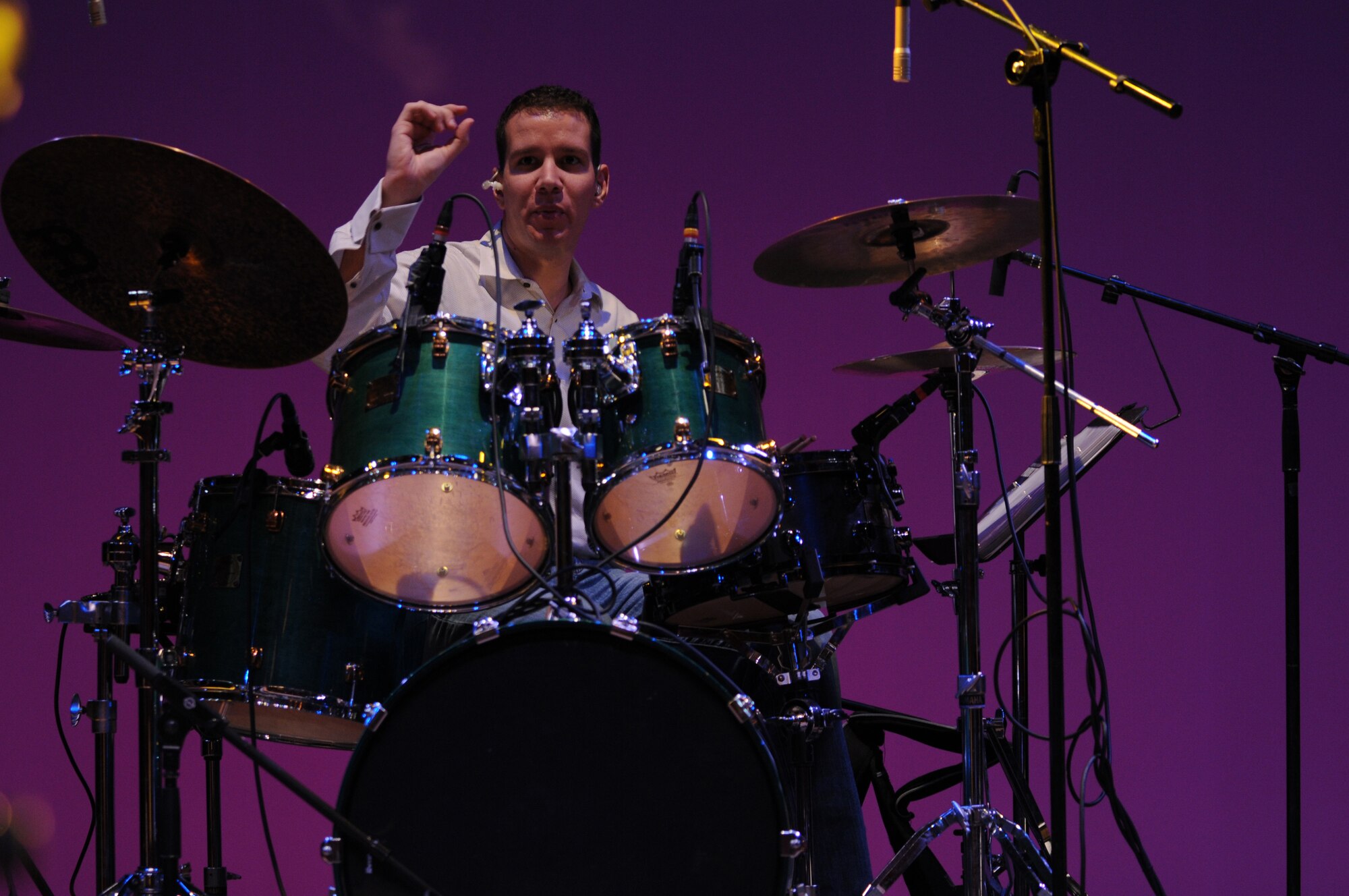 HAMAMATSU CITY, Japan -- Senior Airman Andrew Wendzikowski, U.S. Air Force Band of the Pacific-Asia, plays drums April 18 during a sound check prior to a performance here. The show was the first stop on the band's week-long tour throughout southern Japan. The band enhances goodwill and furthers mutual respect for cultural differences between the citizens of Japan and the United States by performing numerous concerts in the Japanese community. (U.S. Air Force photo/Tech. Sgt. Kimberly Spinner)