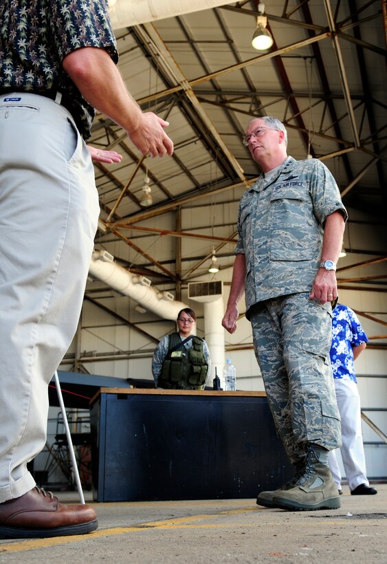 ANDERSEN AIR FORCE BASE, Guam - Mr. Stephen Wolborsky, 36th Wing Chief of Andersen plans and developments, shares with Lt. Gen. Chip Utterback future airfield build up plans during his visit here April 22. General Utterback visited Andersen to speak with Airmen and see base operations first hand. (U.S. Air Force photo by Airman 1st Class Courtney Witt)