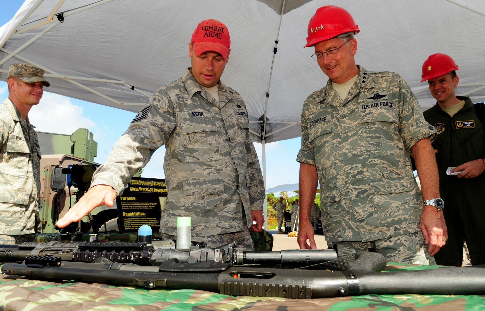 ANDERSEN AIR FORCE BASE, Guam - Combat Arms Tech. Sgt. Robert Kerr, from the 736th Security Forces, explains different defensive equipment used when deployed down range to the 13th Air Force Commander, Lt. Gen. Chip Utterback during his visit to Northwest Field April 22. Northwest field was one of many stops during General Utterbacks tour of Andersen. (U.S. Air Force photo by Airman 1st Class Courtney Witt)