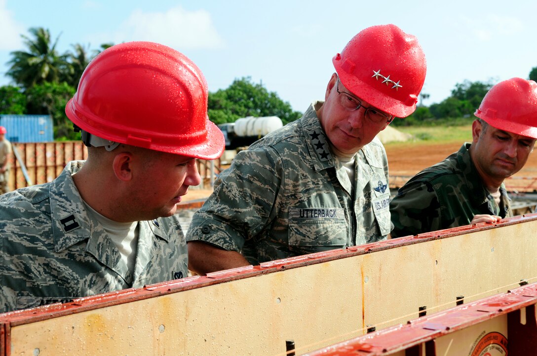 ANDERSEN AIR FORCE BASE, Guam - The 554th RED HORSE Director of Operations, Captain Jason Aftanas, discusses build up techniques, man power, and time spent on each building with 13th Airforce Commander, Lt. Gen. Chip Utterback during his tour of Northwest Field April 22. Once complete the site will be PACAF's future, premier Expeditionary Combat Skills Training Campus providing 80 facilities and infrastructure supporting four units: 554th and 254th RED HORSE Squadrons, Commando Warrior, 644th Combat Communications and 554th Silver Flag onto one base. (U.S. Air Force photo by Airman 1st Class Courtney Witt) 