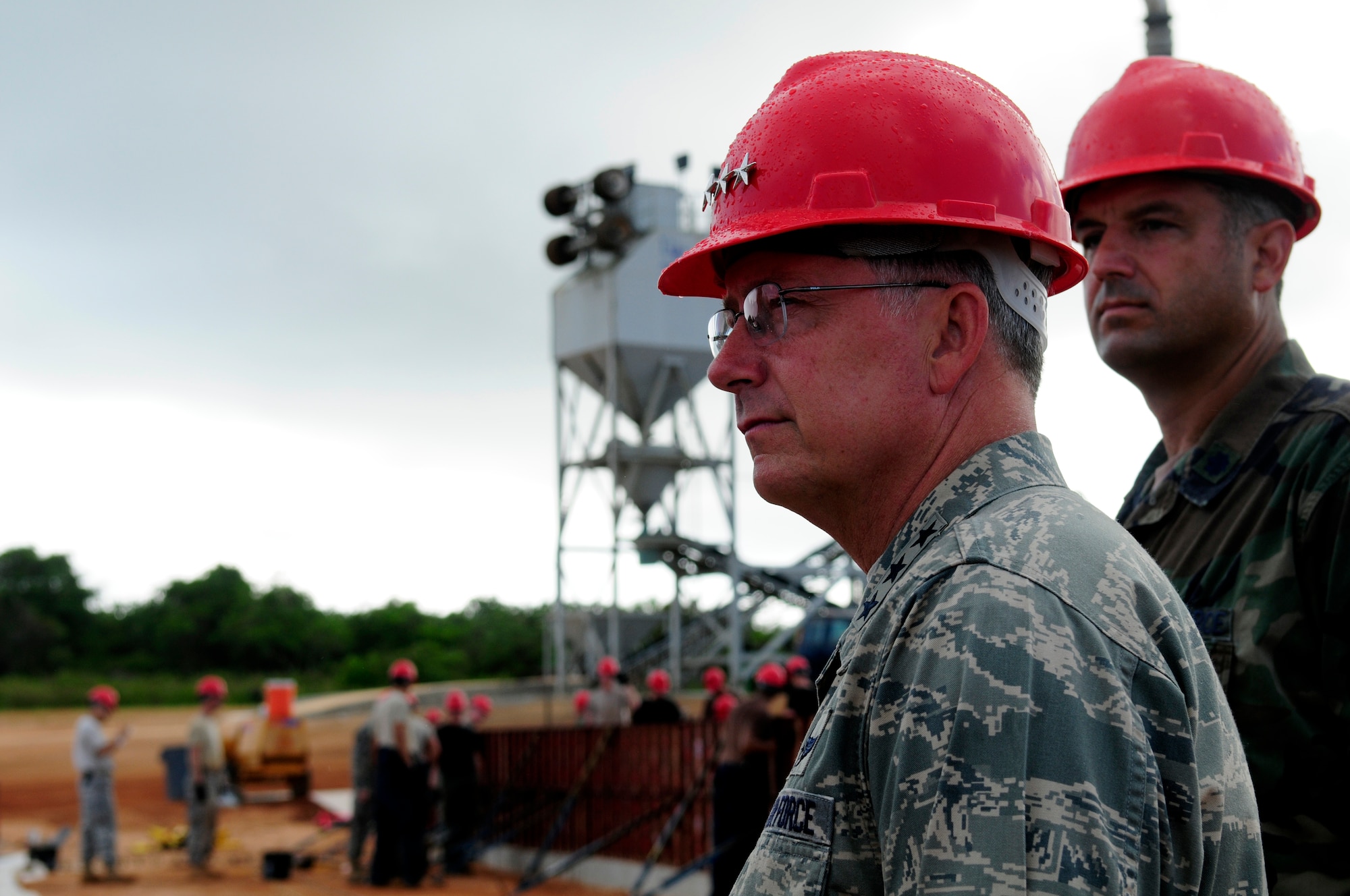 ANDERSEN AIR FORCE BASE, Guam - Lt. Gen. Chip Utterback, 13th Air Force Commander, observes the 554th RED HORSE operations during his tour out at Northwest field April 22. General Utterback was shown the progress that has been made over the past three years with the opening of Commando Warrior Facility to several structures that are close to completion. (U.S. Air Force photo by Airman 1st Class Courtney Witt)