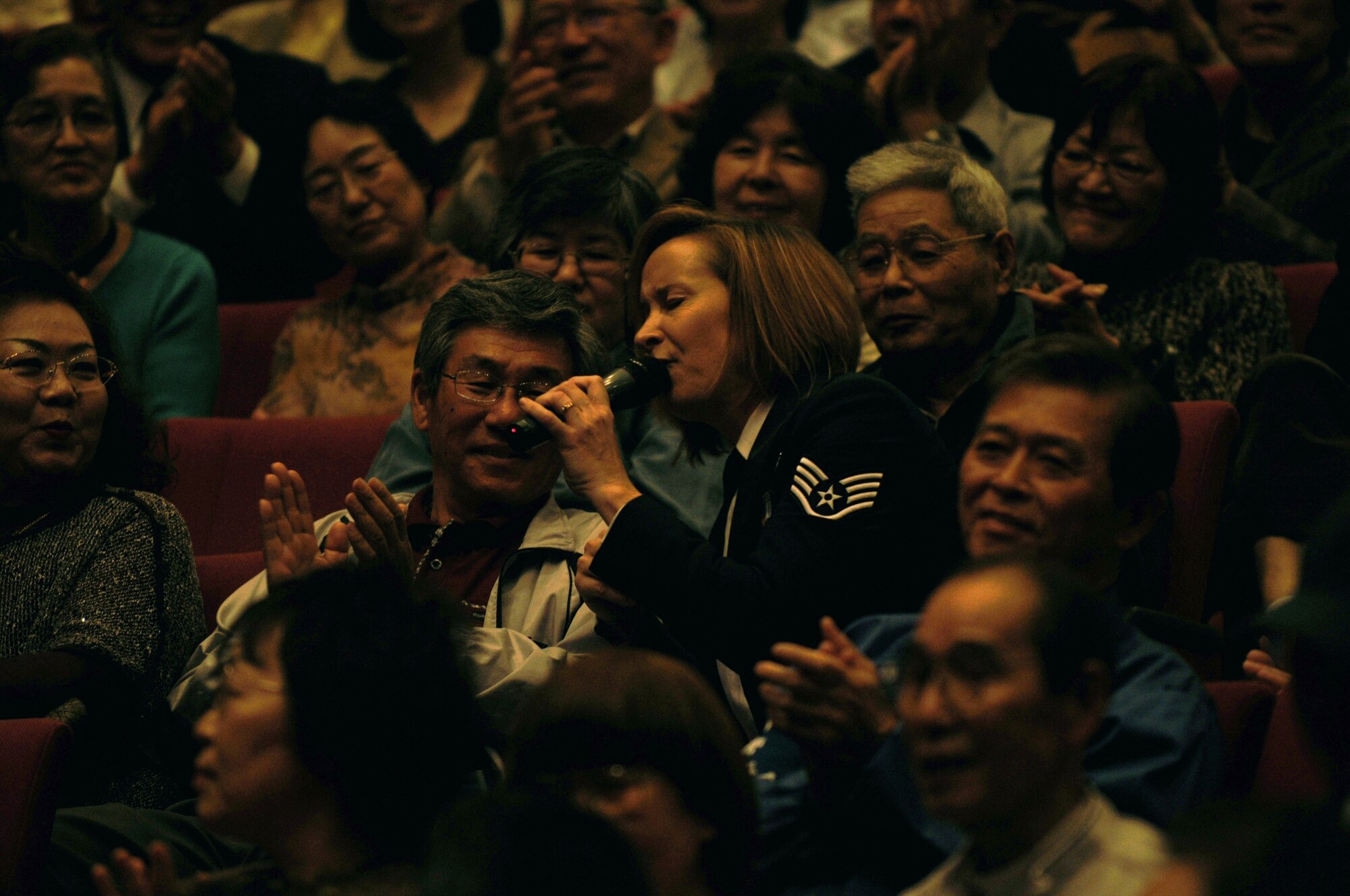 HAMAMATSU CITY, Japan -- Staff Sgt. Rebecca Packard, U. S. Air Force Band of the Pacific-Asia, interacts with the crowd April 18 during a performance here. The show was the first stop on the band's week-long tour throughout southern Japan. The band enhances goodwill and furthers mutual respect for cultural differences between the citizens of Japan and the United States by performing numerous concerts in the Japanese community. (U.S. Air Force photo/Tech. Sgt. Kimberly Spinner)