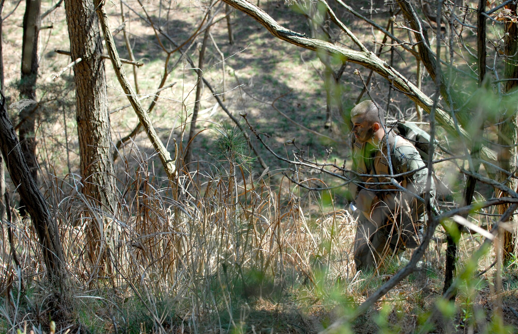 Capt. Shane Willis evades captors during a personnel recovery inspection, part of Osan Air Base's Operational Readiness Inspection, Beverly Bearcat 09-03, April 22.   Captain Willis is assigned to the 25th Fighter Squadron here. (U.S. Air Force photo/Staff Sgt. Brian Ferguson)
