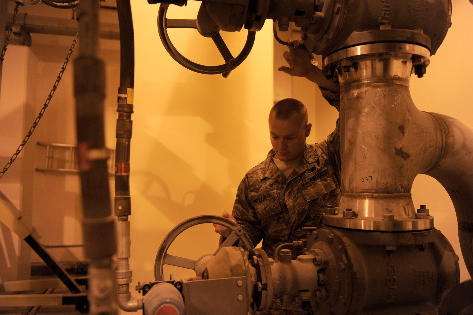 Senior Airman. Isaac Taylor, 380th Expeditionary Logistics Readiness Squadron, fuels flight, prepares "Bubba," a type three hydrant system, for receipt of fuel, April 4 at an undisclosed location in Southwest Asia. "Bubba" is utilized to issue 100% of the JP8 Fuel to the 380th Air Expeditionary Wing. Airman Taylor is deployed from Little Rock AFB, Ark. and hails from Searcy, Ark. (U.S. Air Force photo by Senior Airman Brian J. Ellis) (Released)