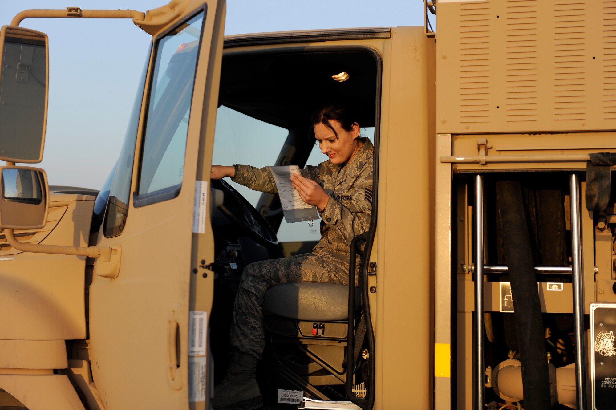Staff Sgt. Rachel Richardson, 380th Expeditionary Logistics Readiness Squadron, fuels flight, reviews her A-man checklist to ensure all steps have been performed before she exits the fuels checkpoint operation on an R-11 fuel truck at an undisclosed location in Southwest Asia, April 4. Airman Richardson is deployed from Hurlburt Field, Fla. and hails from Cleveland, Tenn. (U.S. Air Force photo by Senior Airman Brian J. Ellis) (Released)