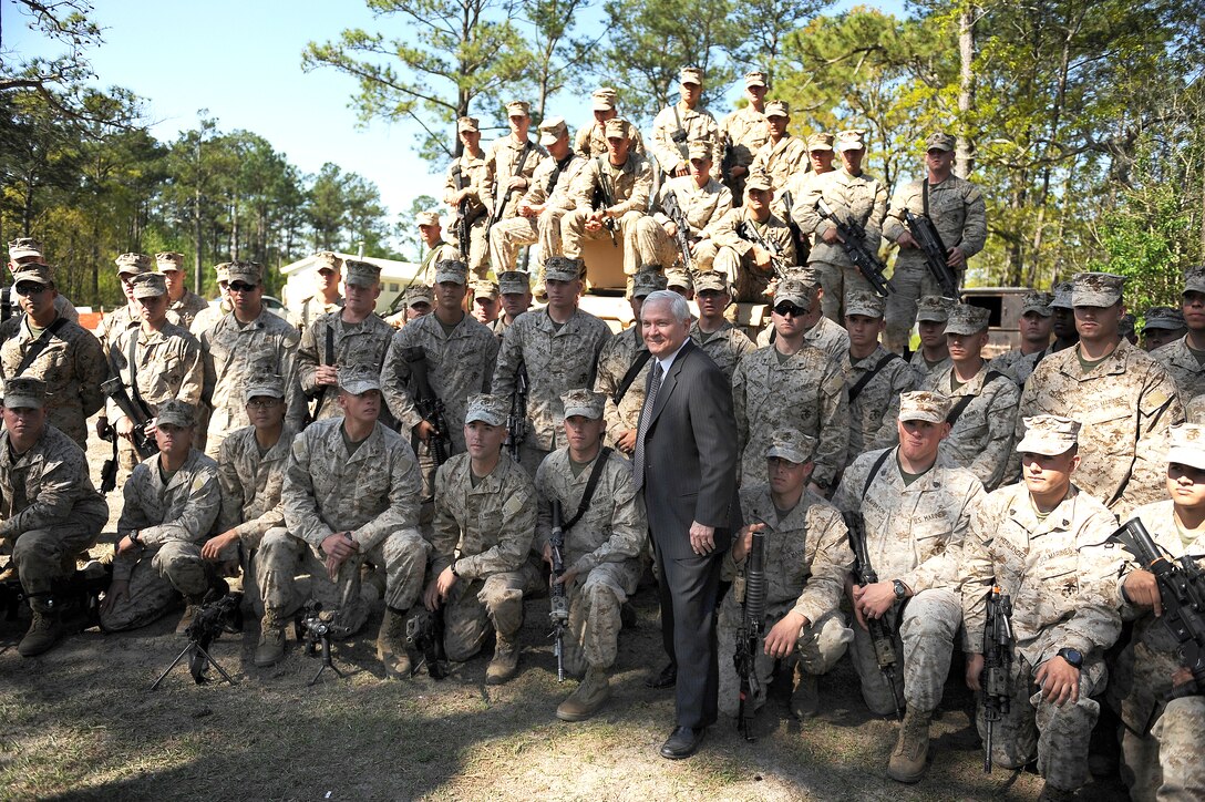 Defense Secretary Robert M. Gates poses for a photo after a demonstration at the improvised explosive device area while visiting Marines on Camp Lejeune, N.C., April 23, 2009.