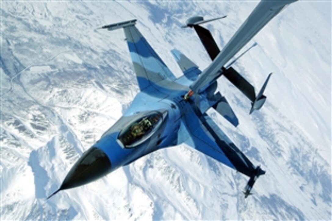An F-16 Aggressor flys in contact position at 27,000 feet while a KC-10 Extender off-loads fuel during Red Flag-Alaska, a training exercise, on Eielson Air Force Base, Alaska, April 22, 2009. The F-16 is assigned to the 18th Aggressor Squadron. The Joint Pacific Alaskan Range Complex provides 67,000 square miles of airspace, including two tactical bombing ranges containing more than 400 different types of targets.